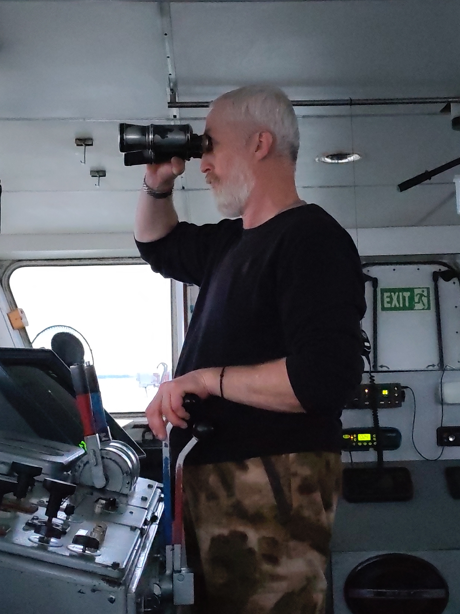 Ship crew navigates choppy waters during nighttime voyage