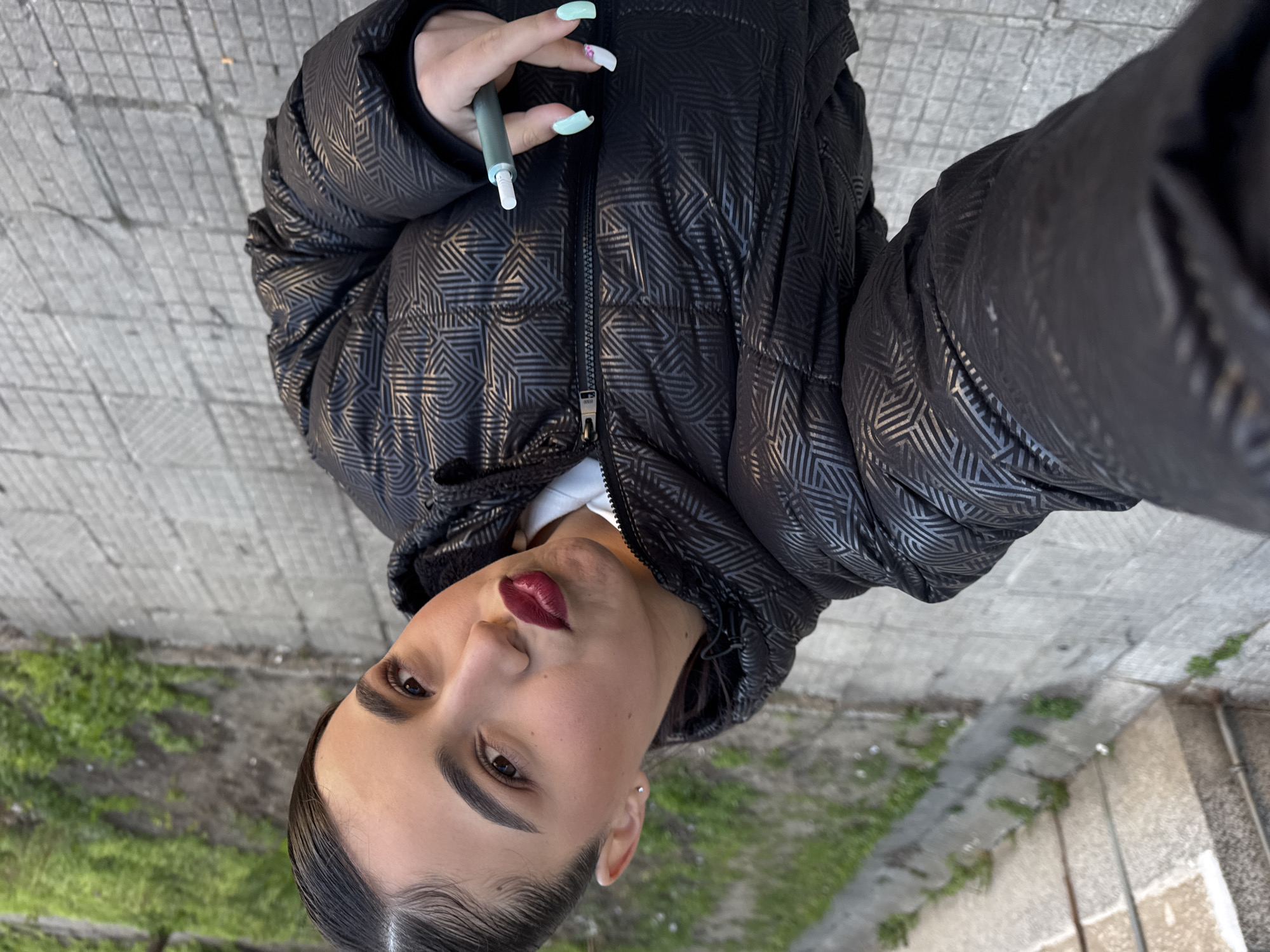 Woman with e-cigarette spotted in Sofia wearing puffer jacket