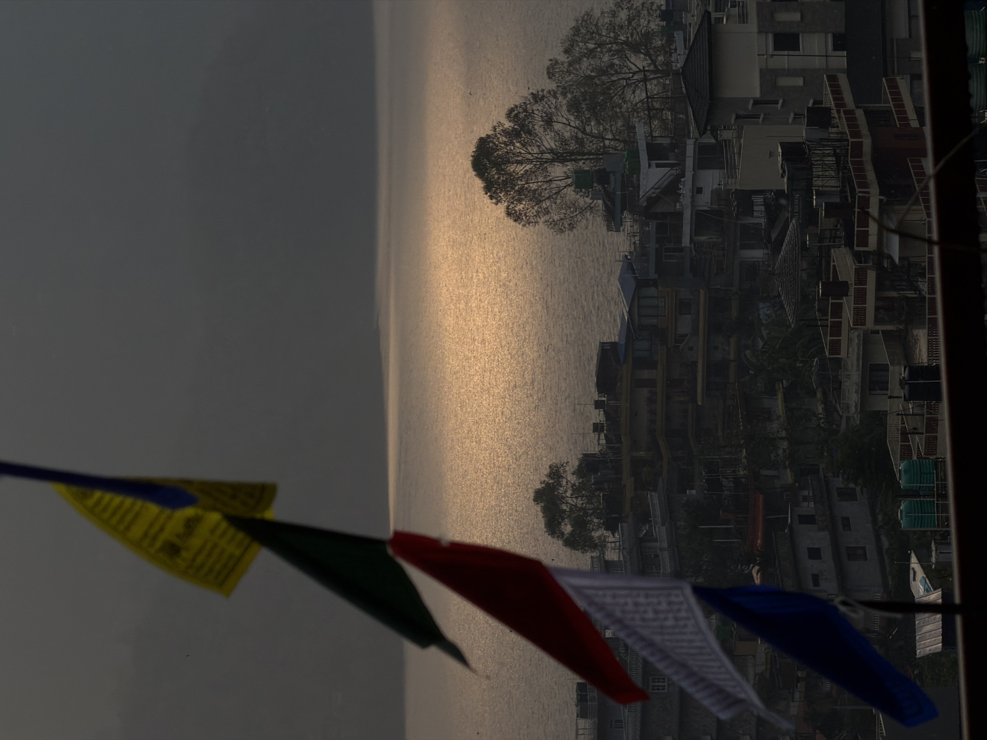 Man performs rooftop backflip overlooking Pokhara cityscape