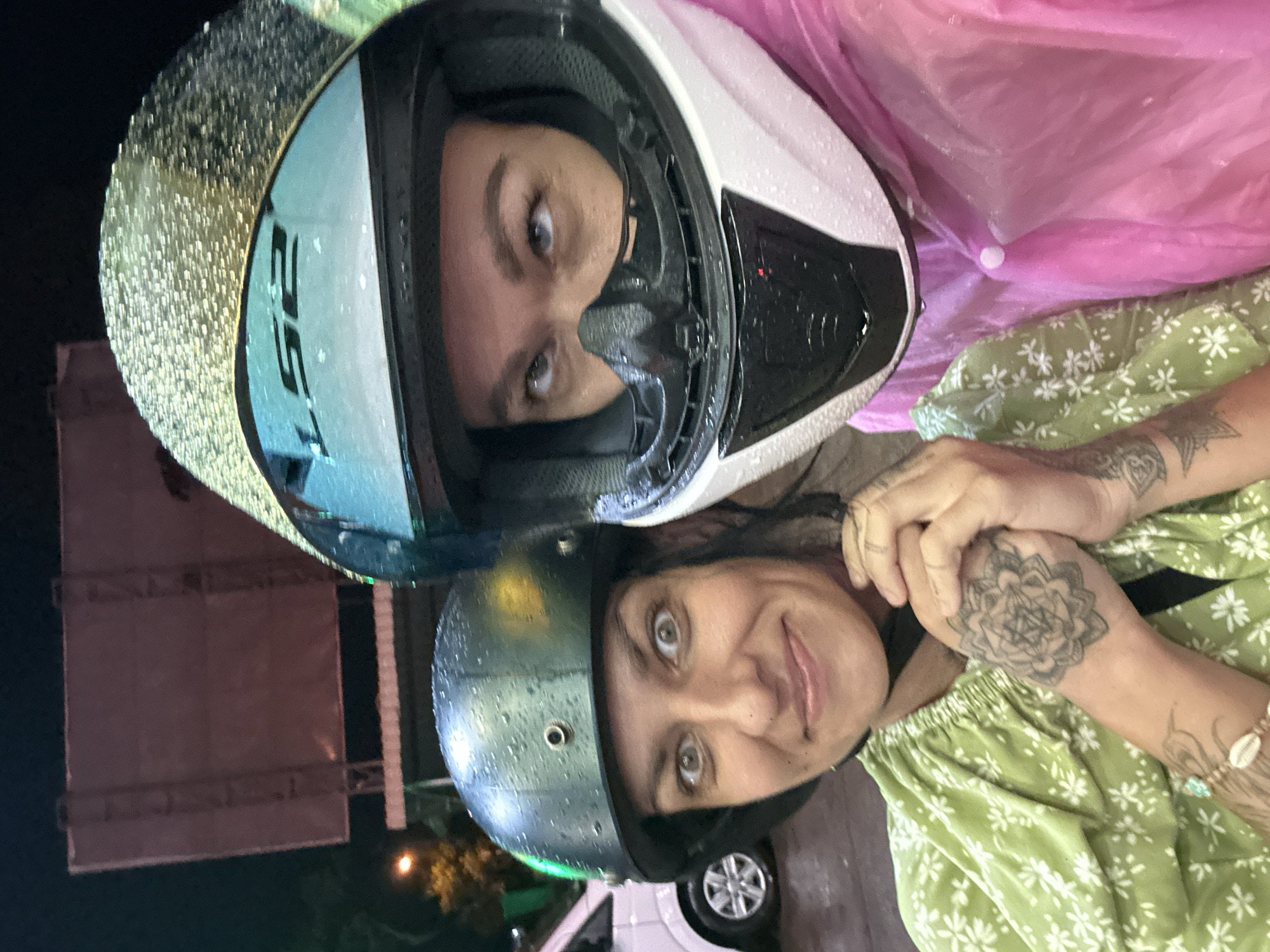 Nighttime refueling activities observed at Vietnam gas station during rain