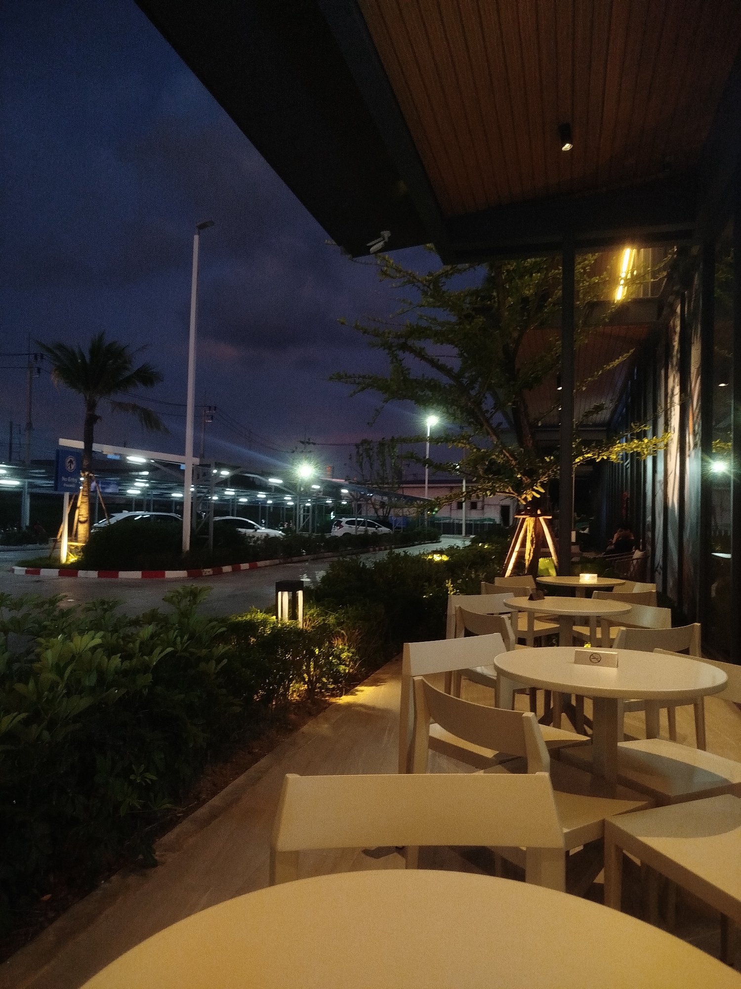 Dusk light hits Choeng Thale's commercial strip, construction and all