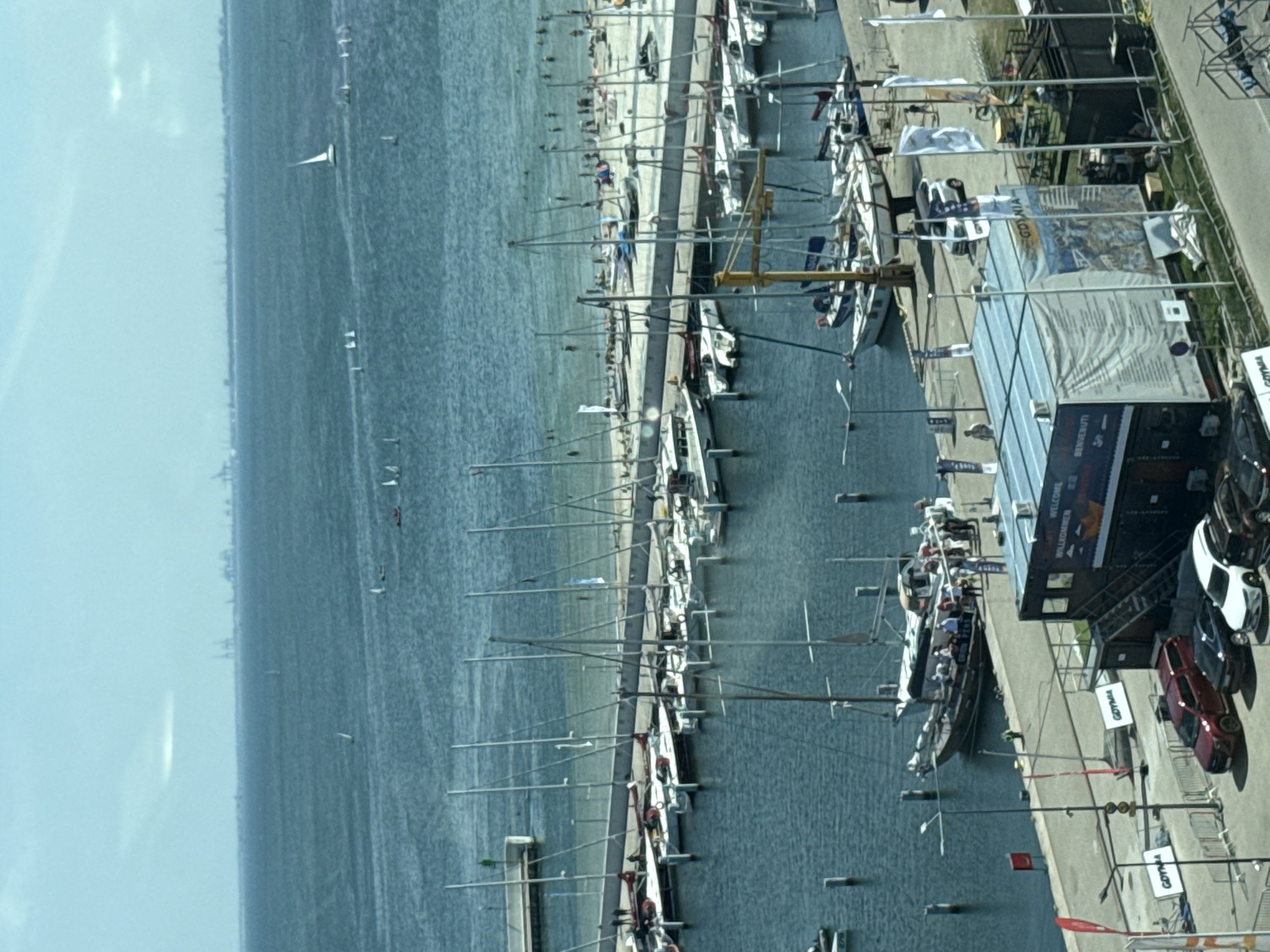 Gdynia marina buzzes with sailboats, a tall ship, and waterfront construction