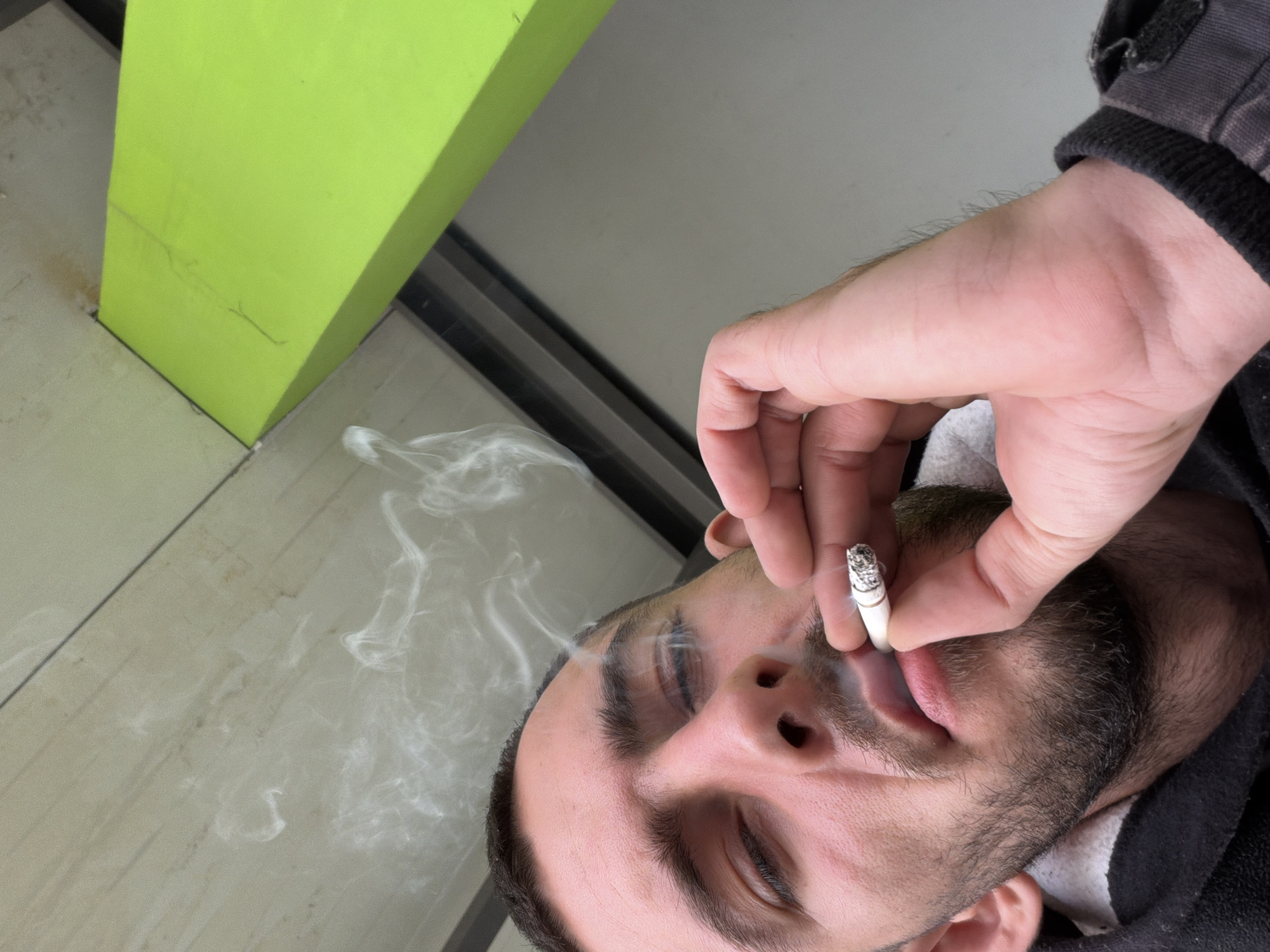 Man photographed smoking cigarette in Bulgarian village
