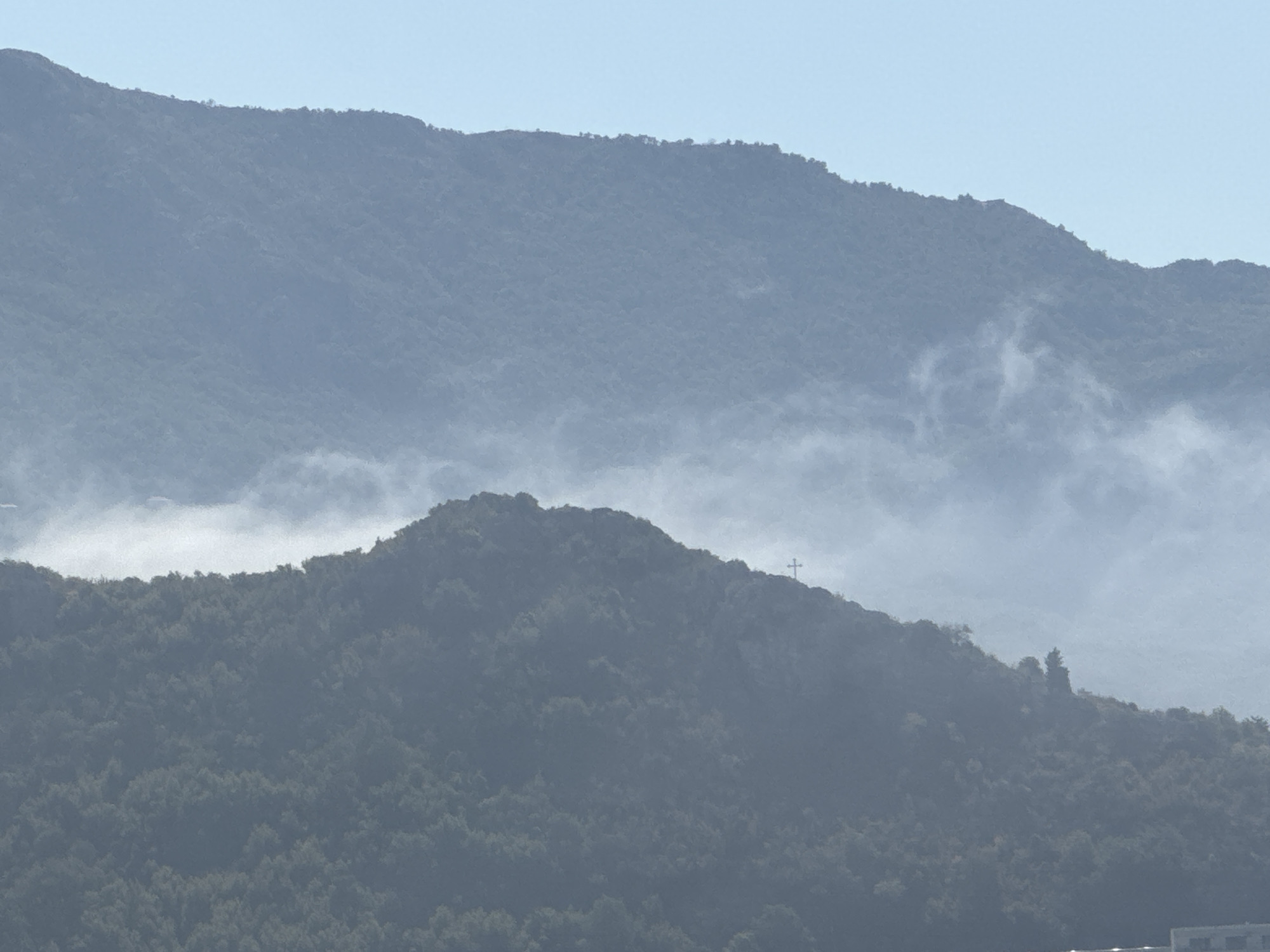 Beach, ruins, and mountain mist in coastal Montenegro
