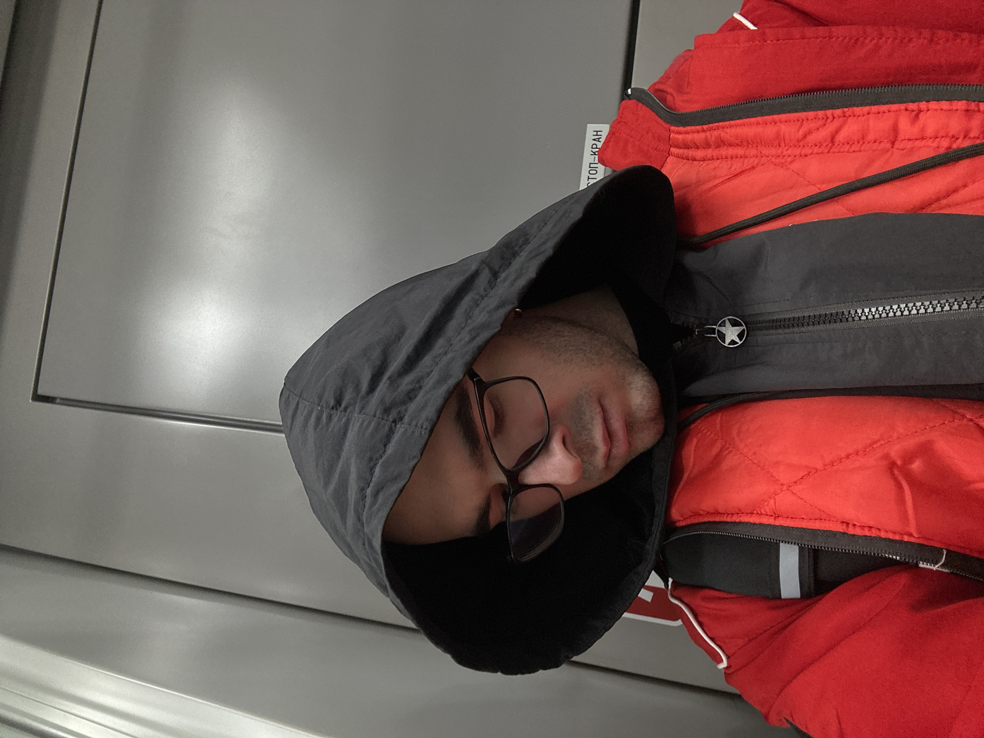 Man sleeps on Moscow public transport amid morning commute