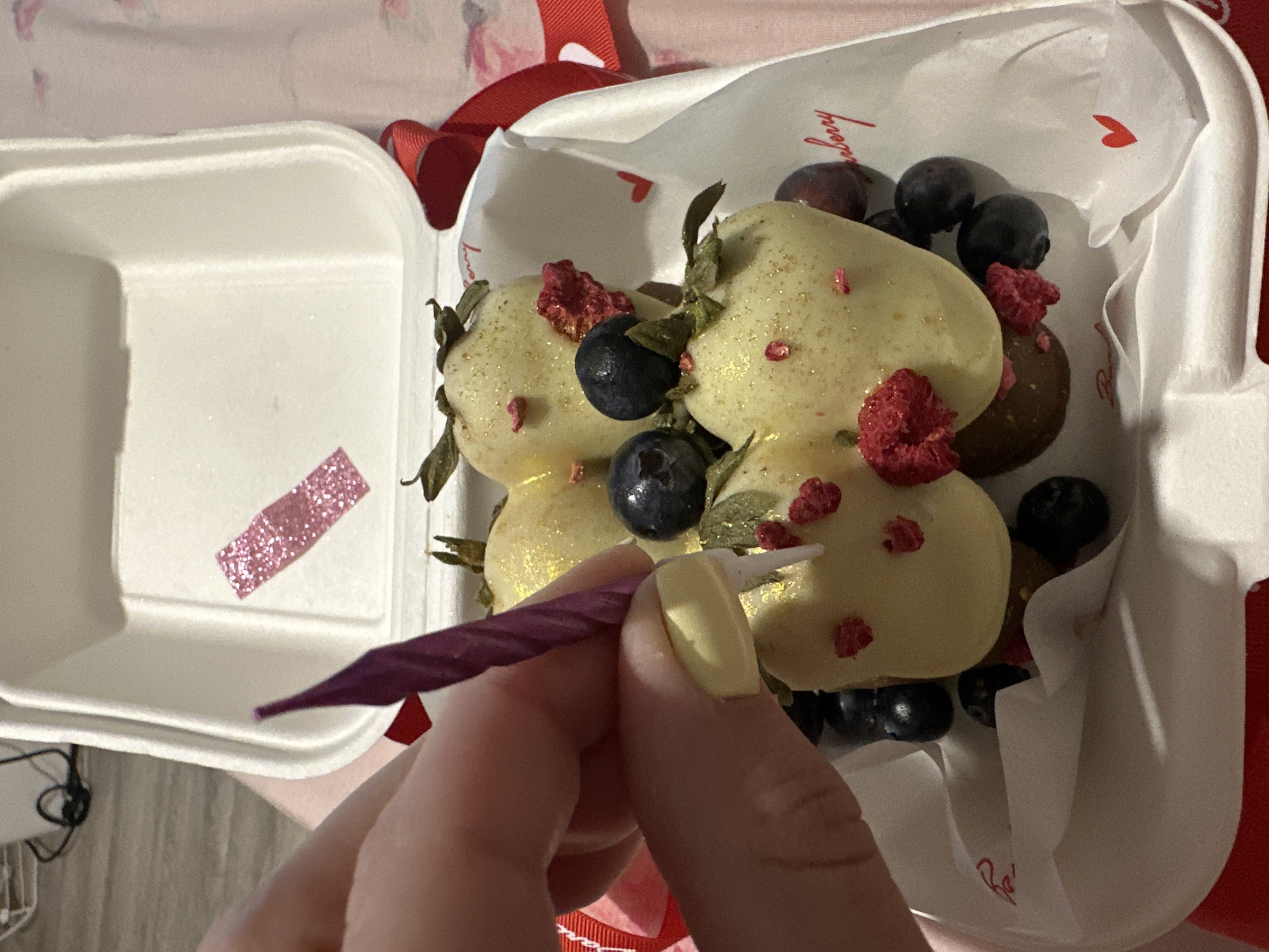 Woman receives chocolate berries from Barberry shop in Perm