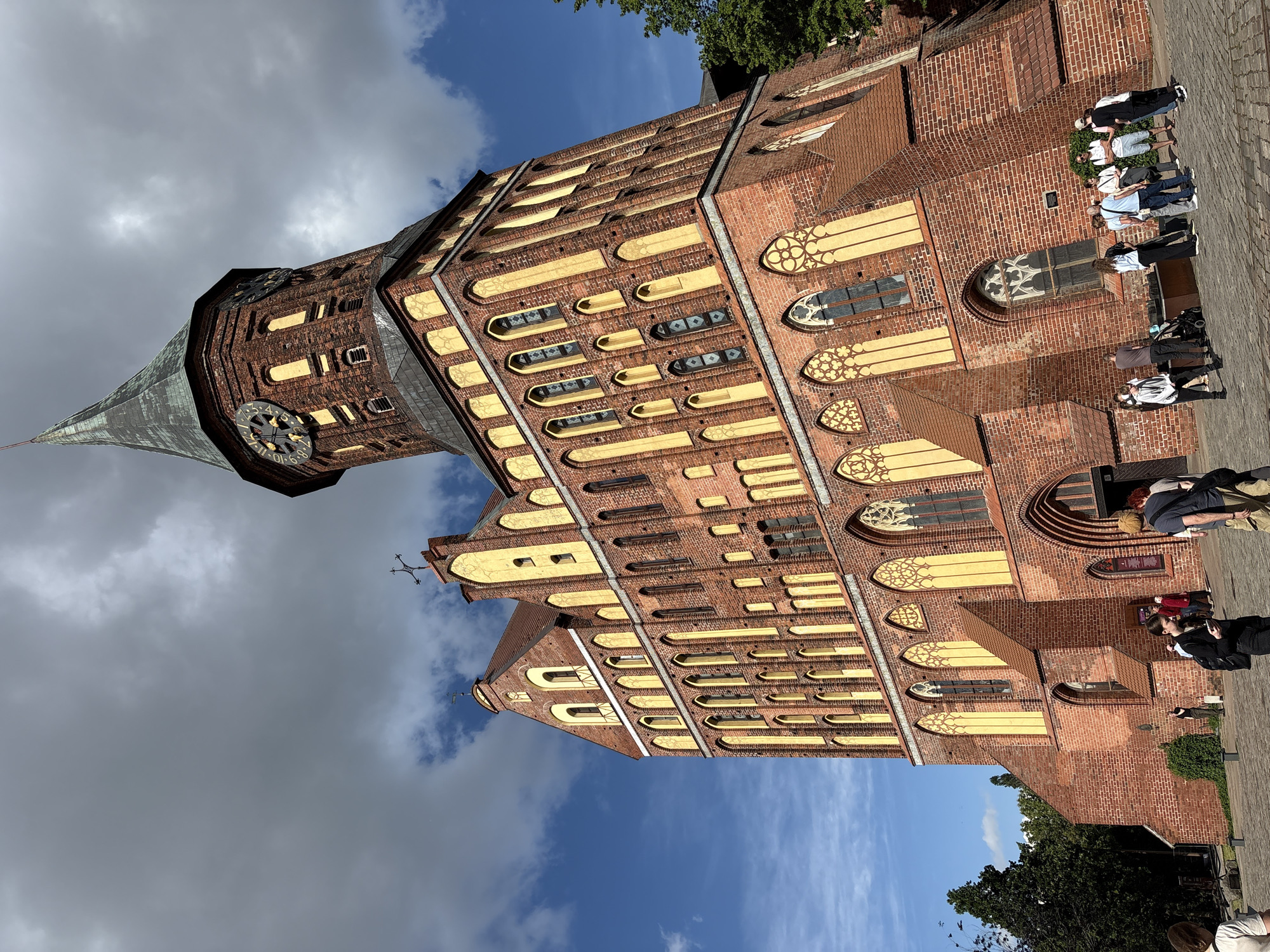 Sunny afternoon tourist activity documented at Kaliningrad historic waterfront