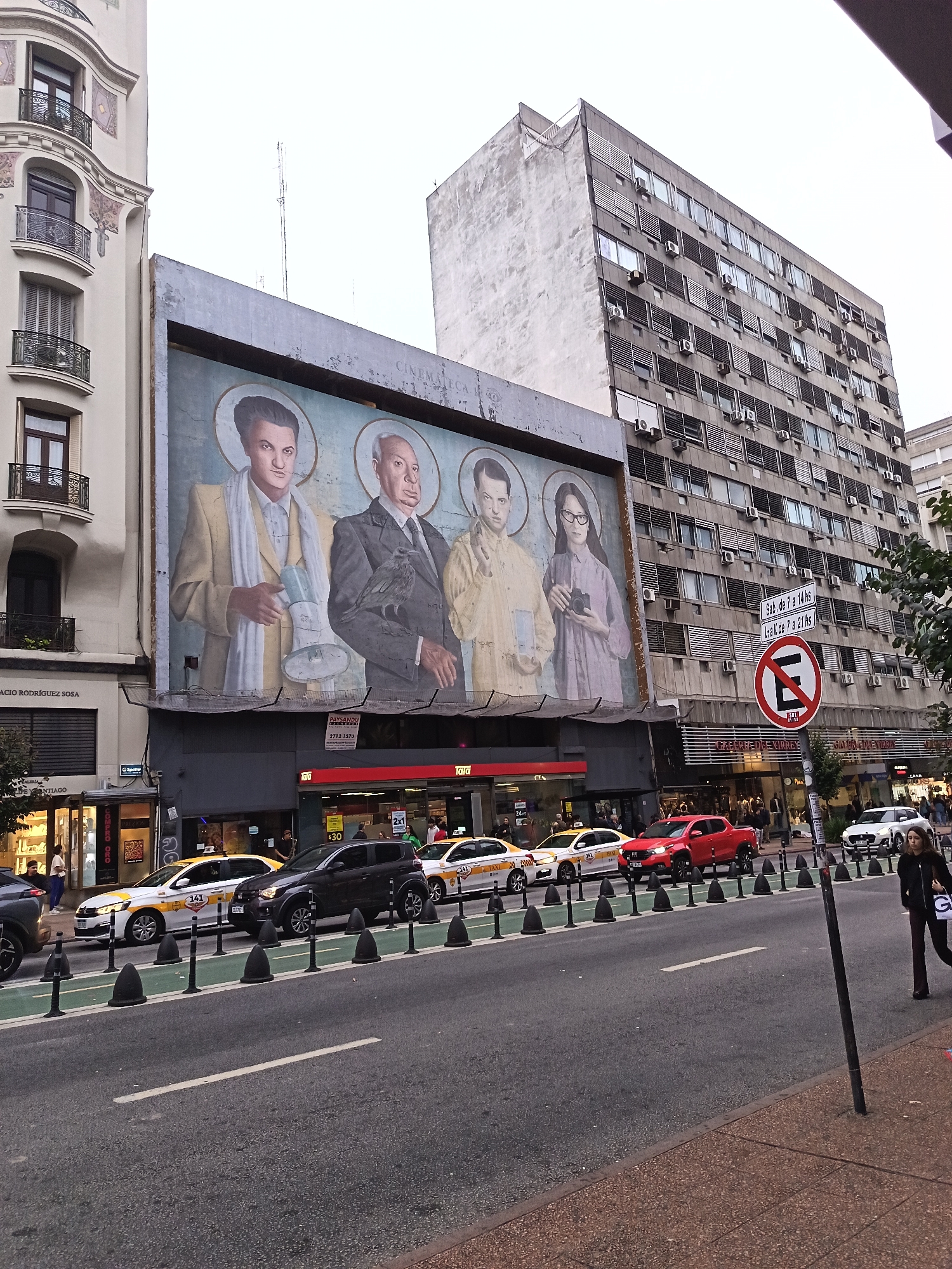 Religious mural featuring four haloed figures spotted in Montevideo