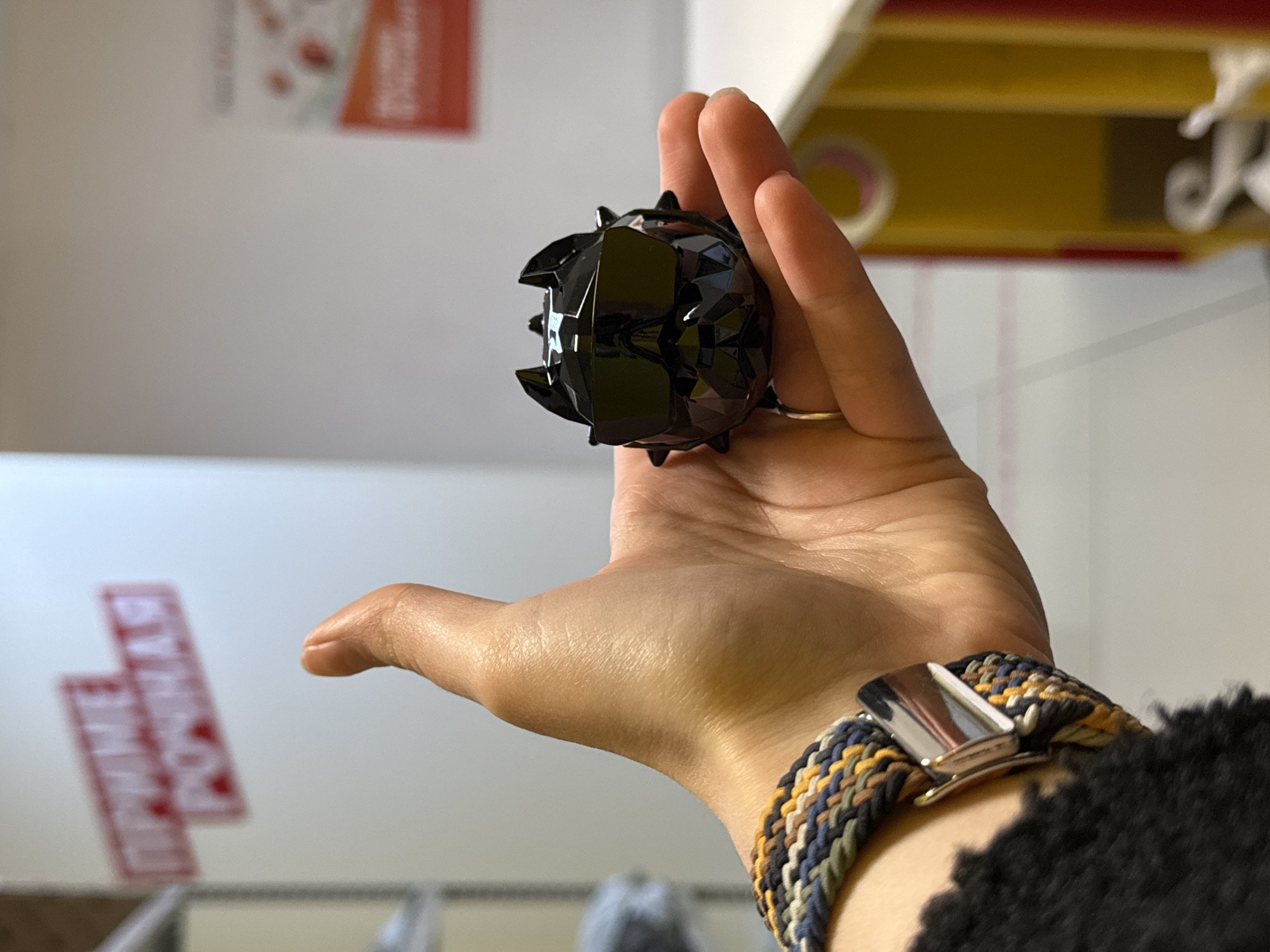Person documents unboxing black spiked car accessory over 77 minutes