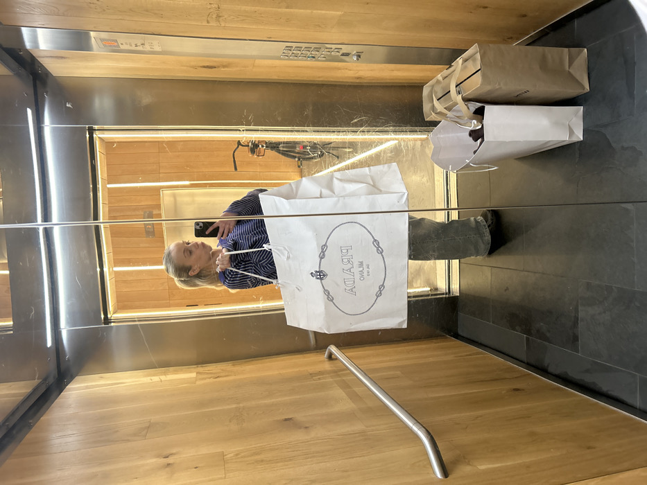 Woman spotted in London commercial building elevator and corridor