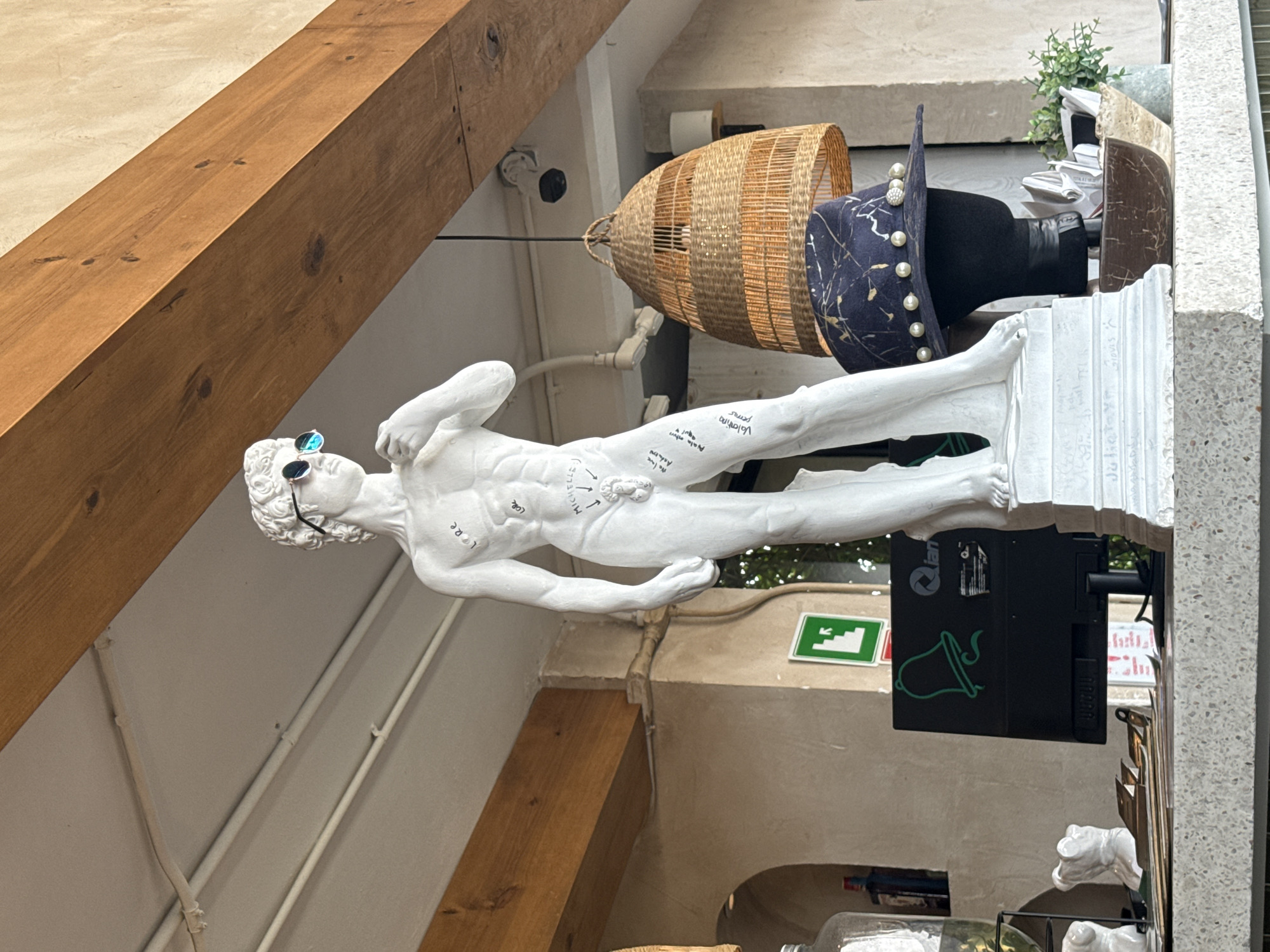 Sunglasses-wearing David statue spotted lying horizontal in Cholula room