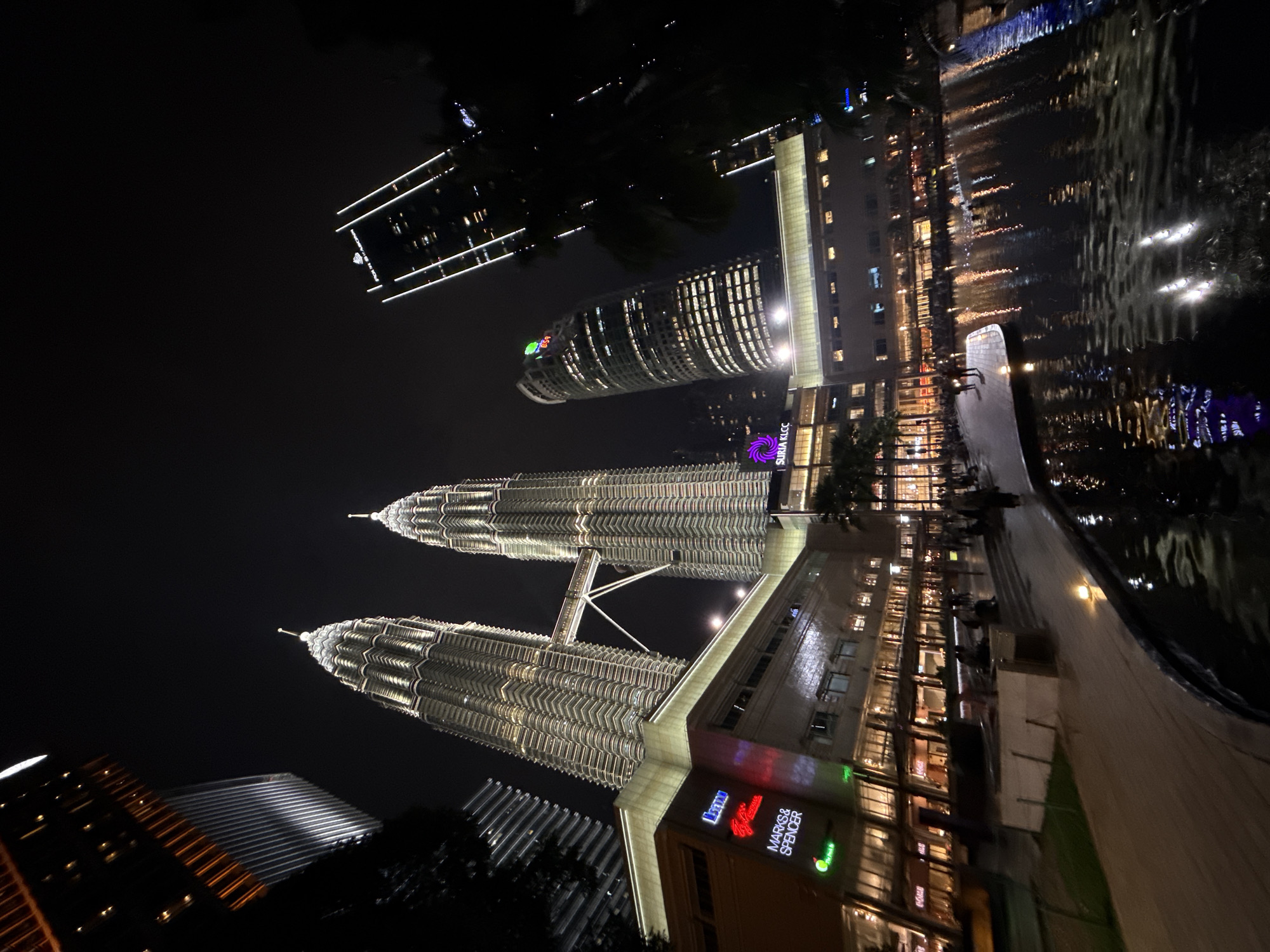 Petronas Twin Towers captured illuminated at night in Kuala Lumpur
