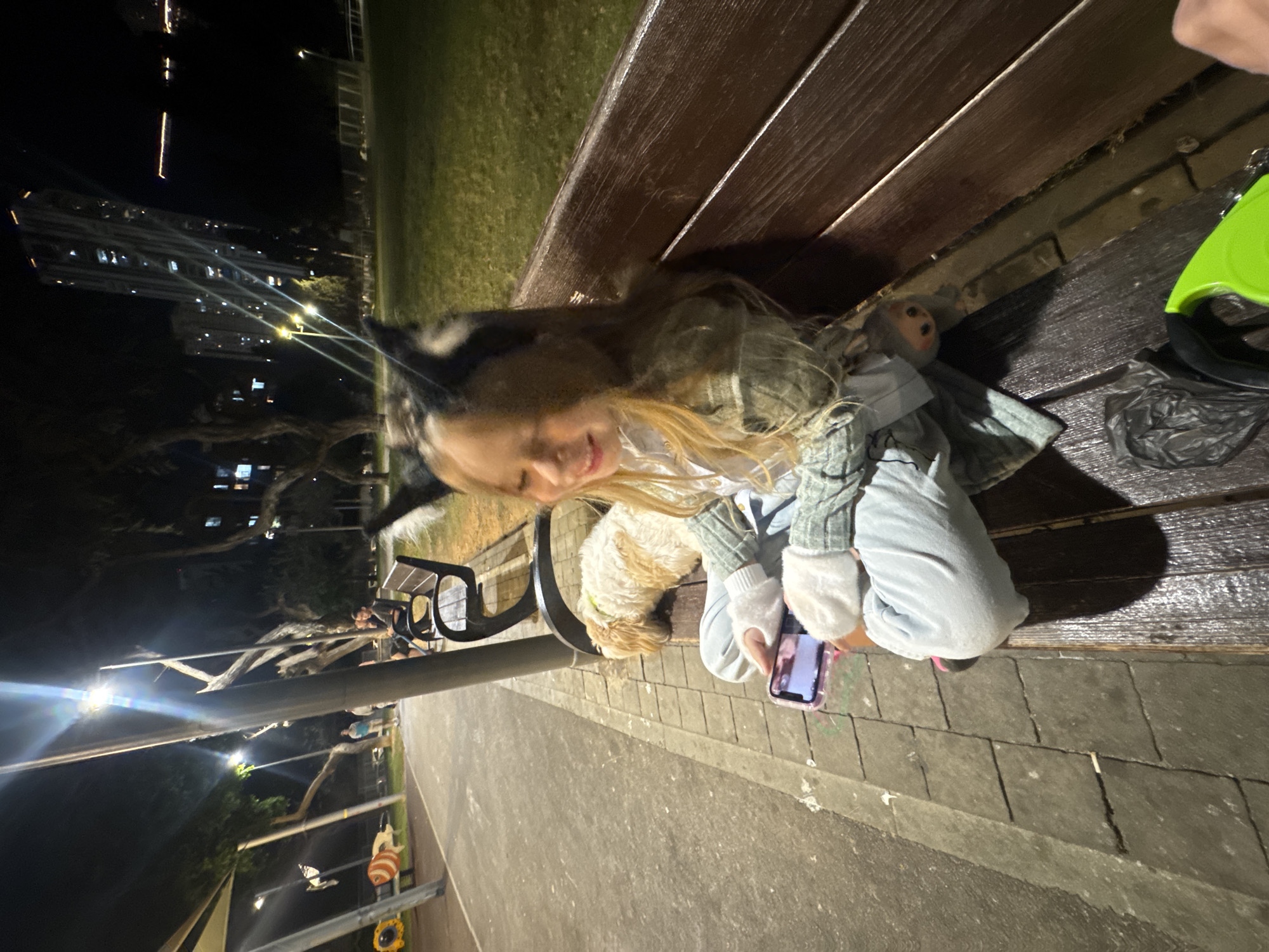 Girl spends afternoon with dog in Bat Yam park