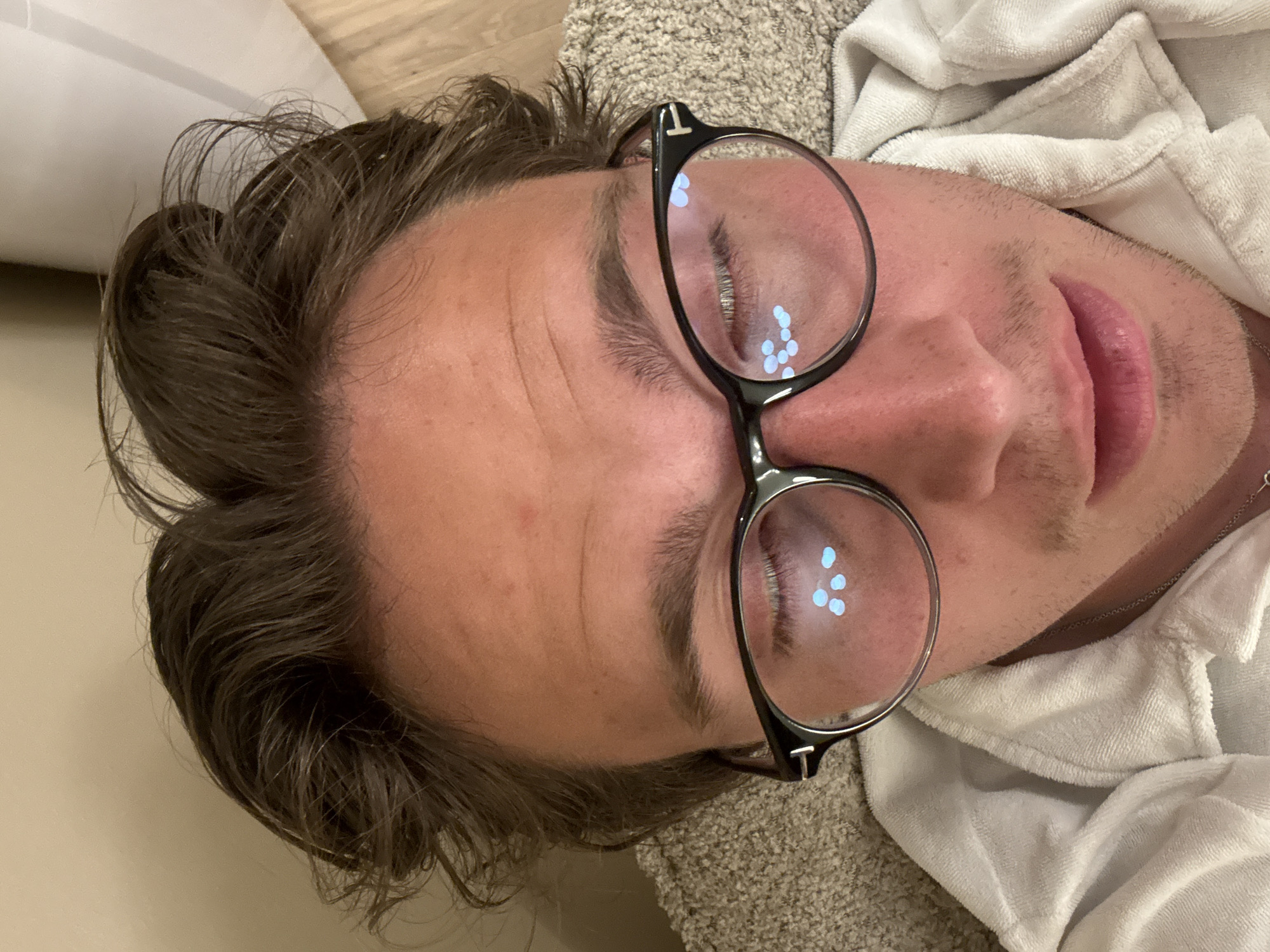 Portrait captured of person with glasses resting in Oslo