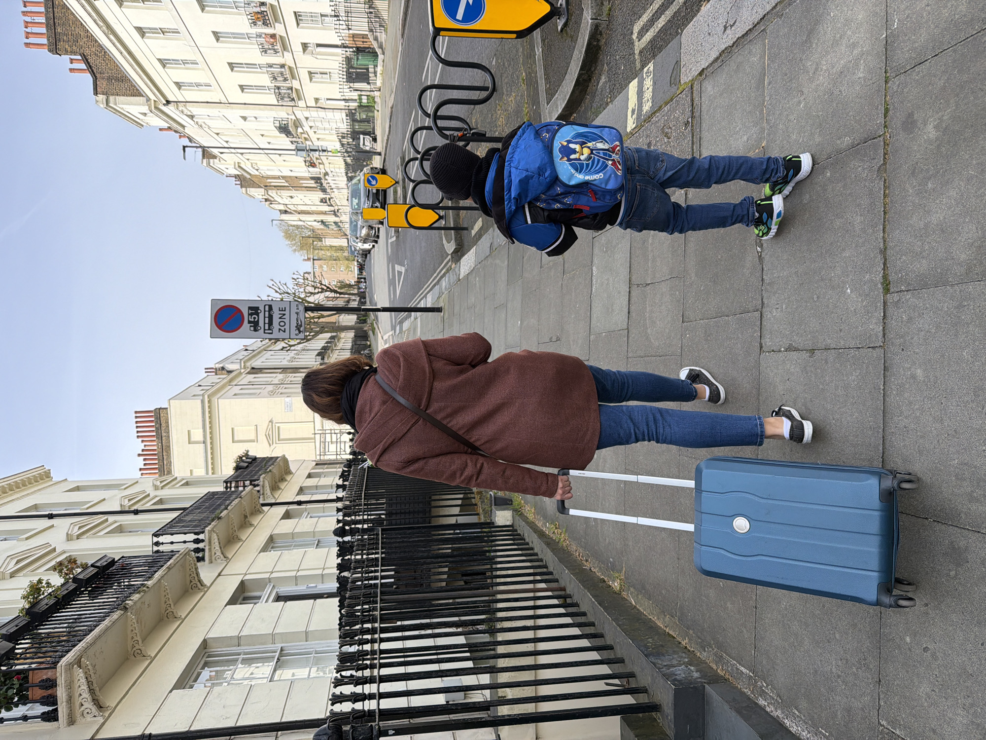 Morning pedestrians and window cat spotted in central London