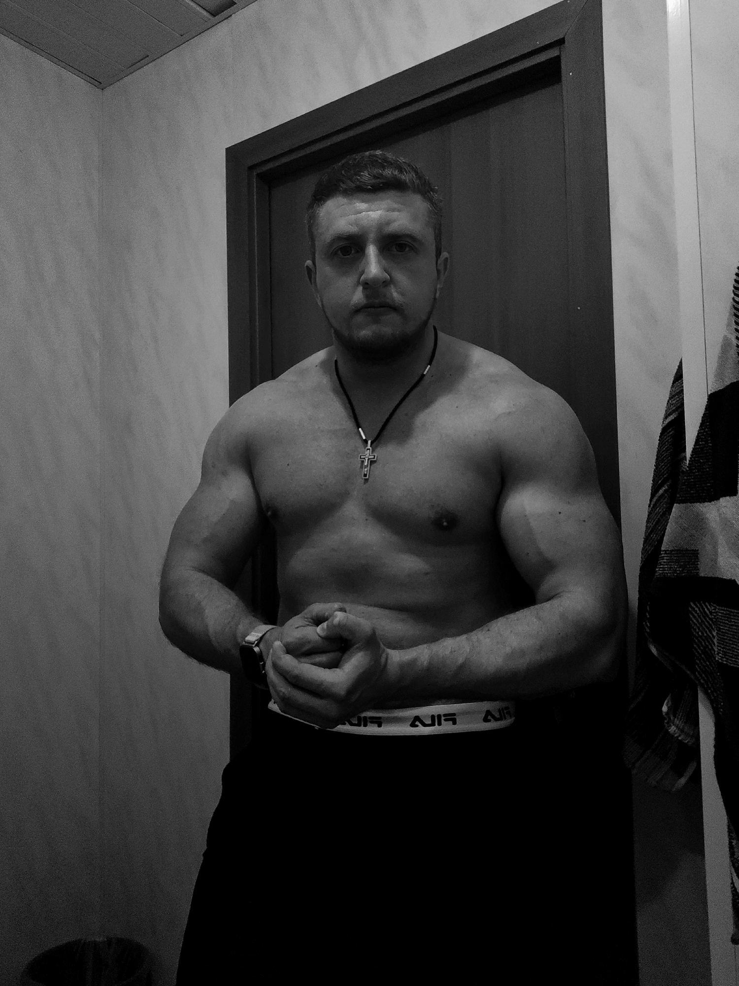 Man photographed posing in bathroom, location unknown