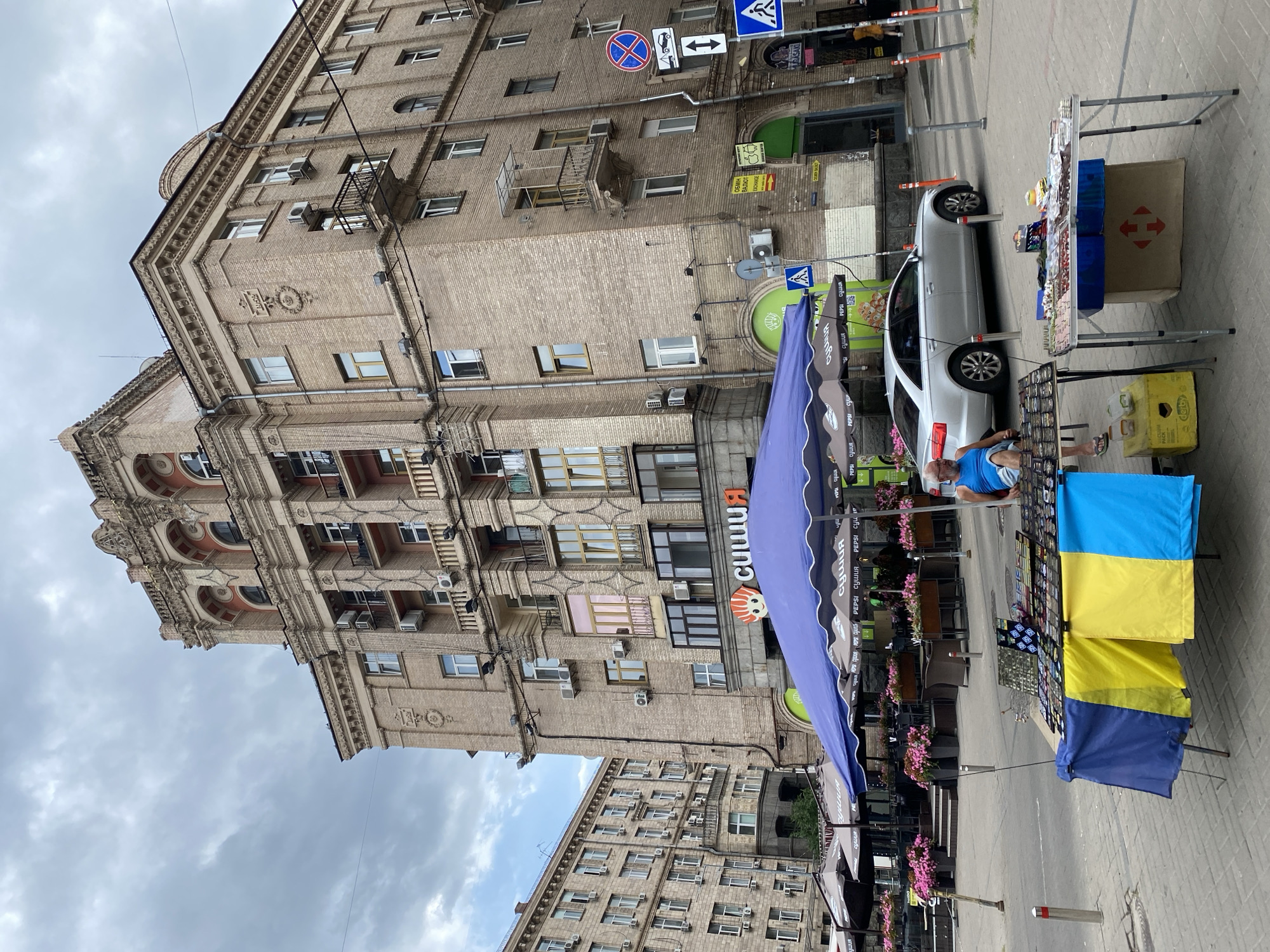 Street-level tour through ornate urban architecture on a cloudy day