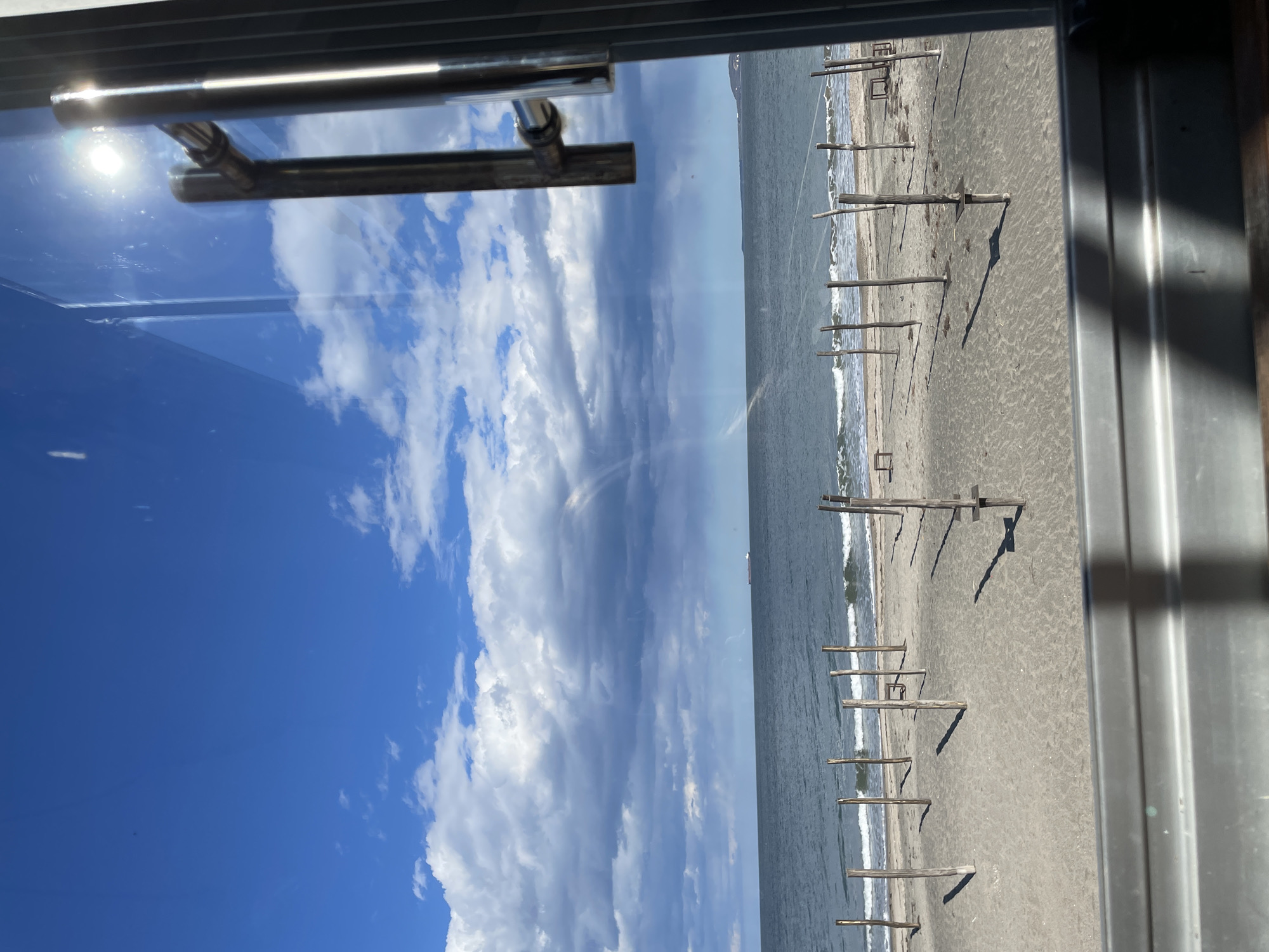 Beach view observed through window in Burgas, Bulgaria