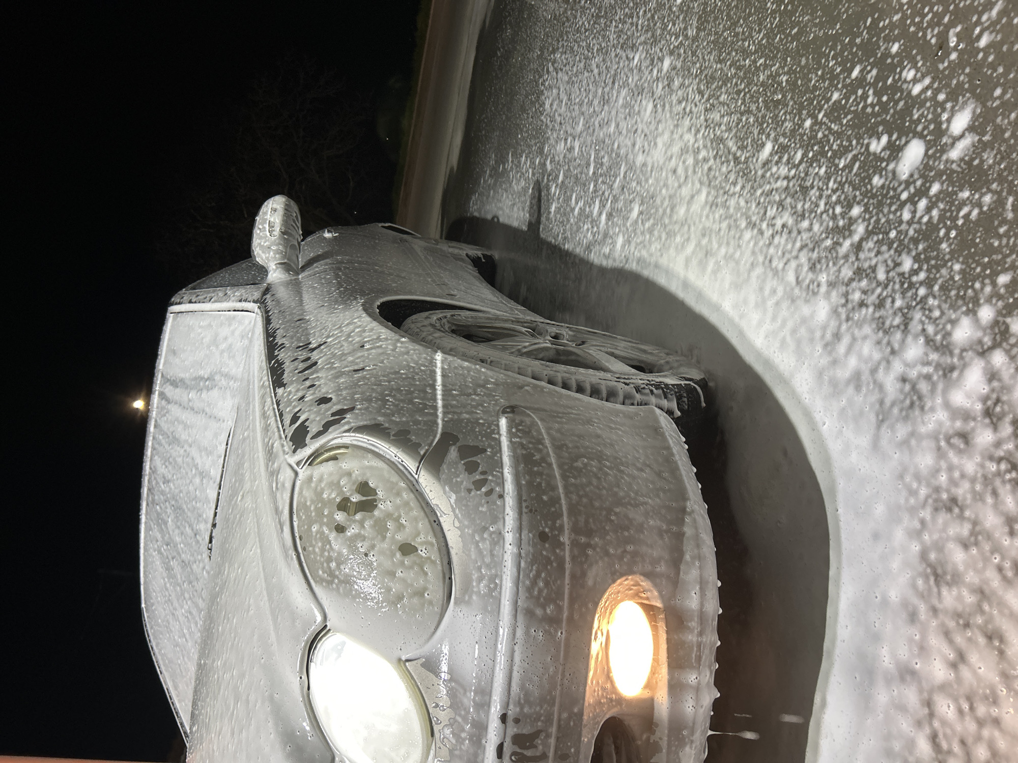 Mercedes receives nighttime foam wash in Strelcha, Bulgaria