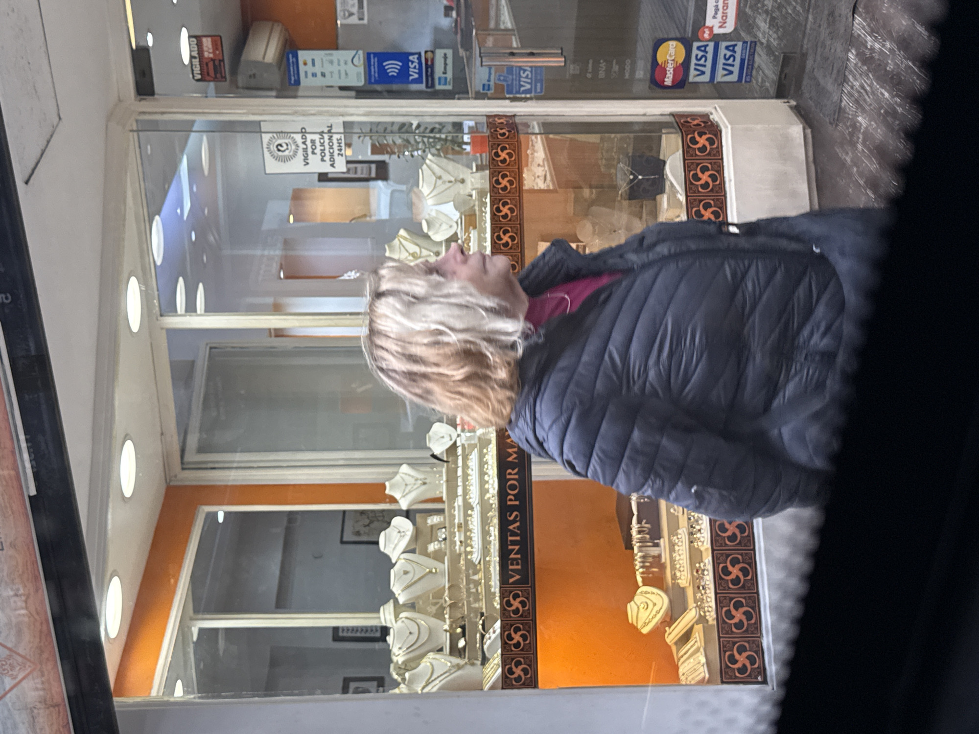 Woman window shops jewelry stores in Buenos Aires