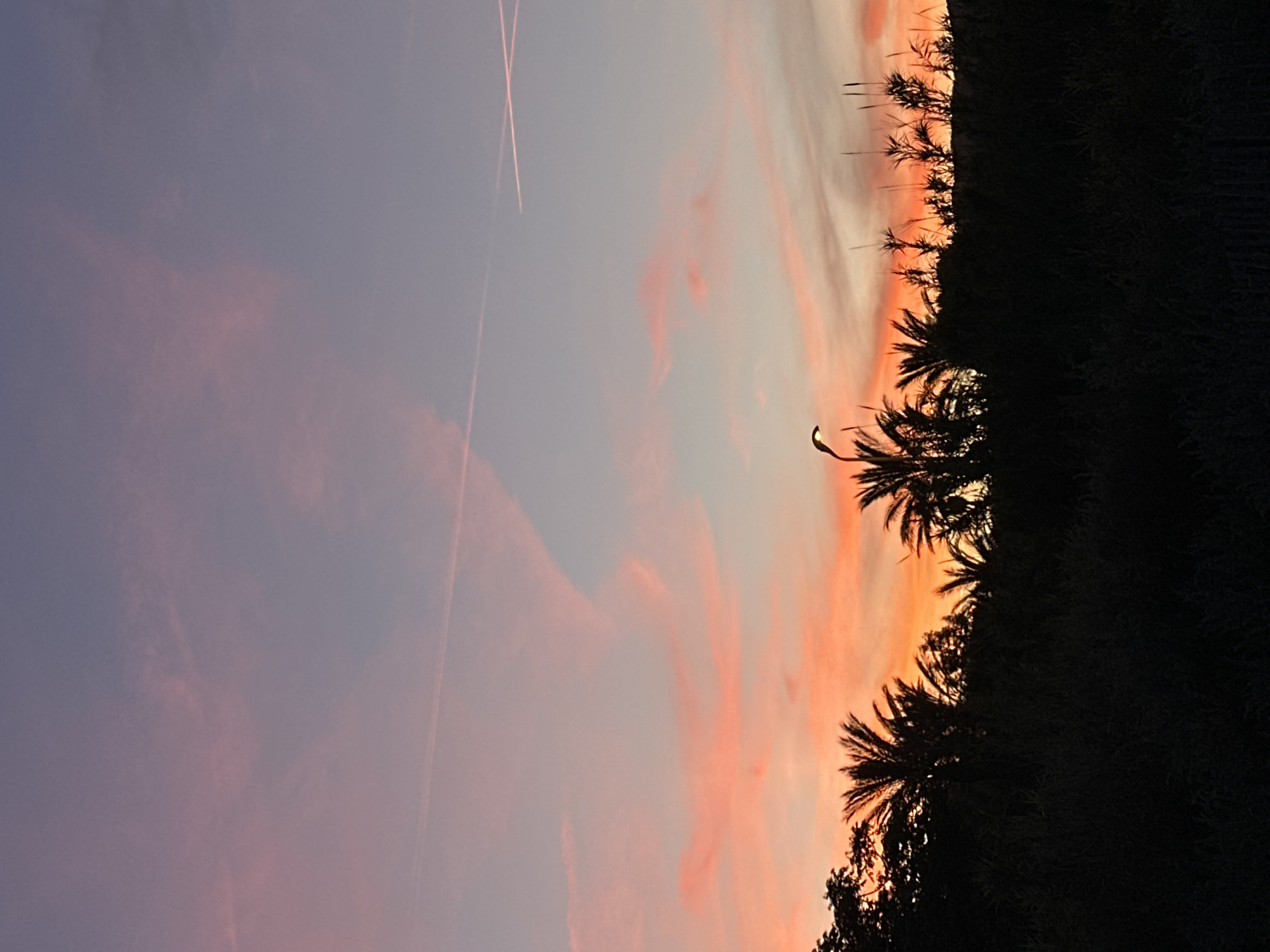 Sunset colors illuminate Le Lavandou coastline and lighthouse