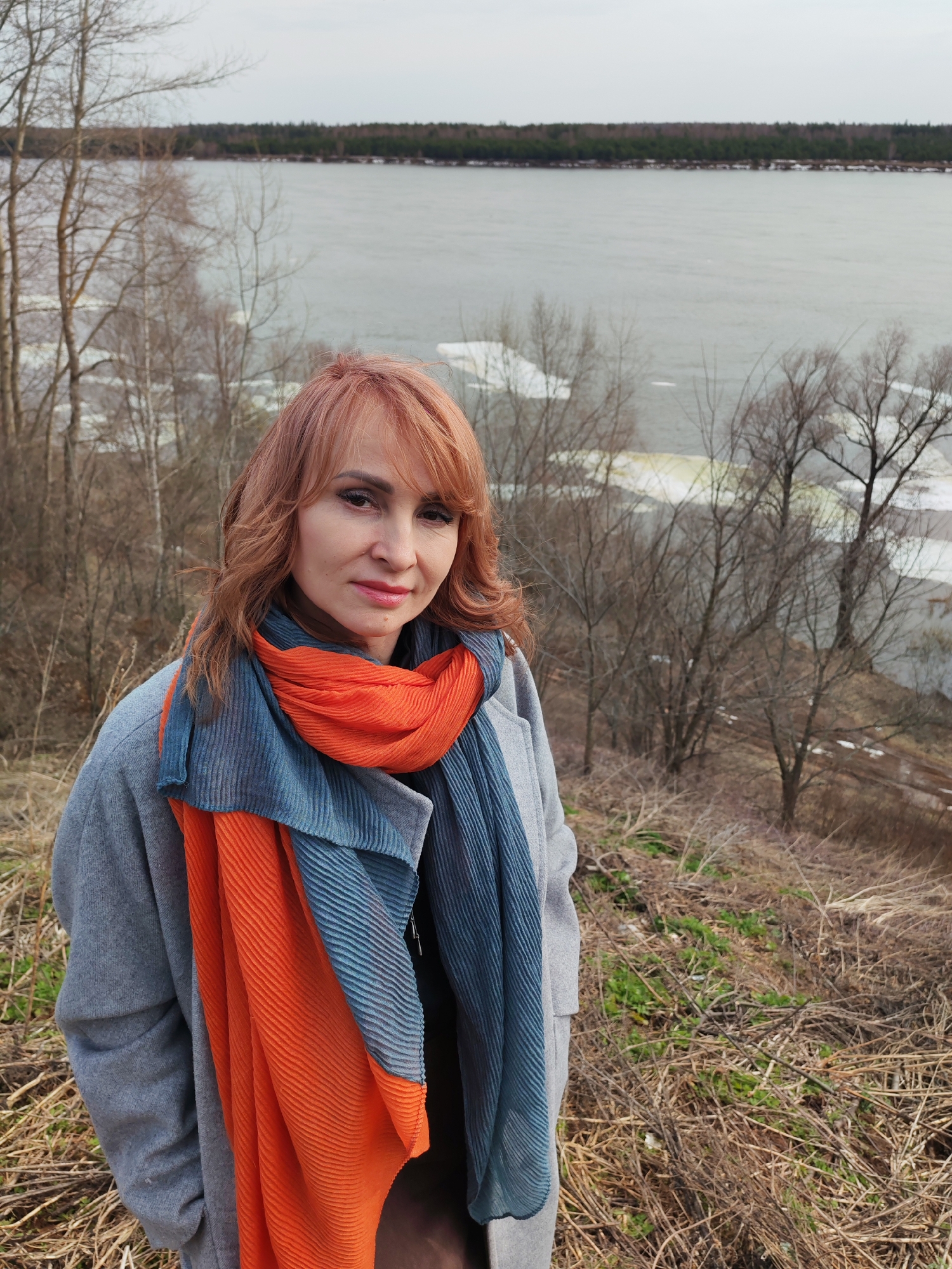 Woman observes spring ice breakup on Russian river