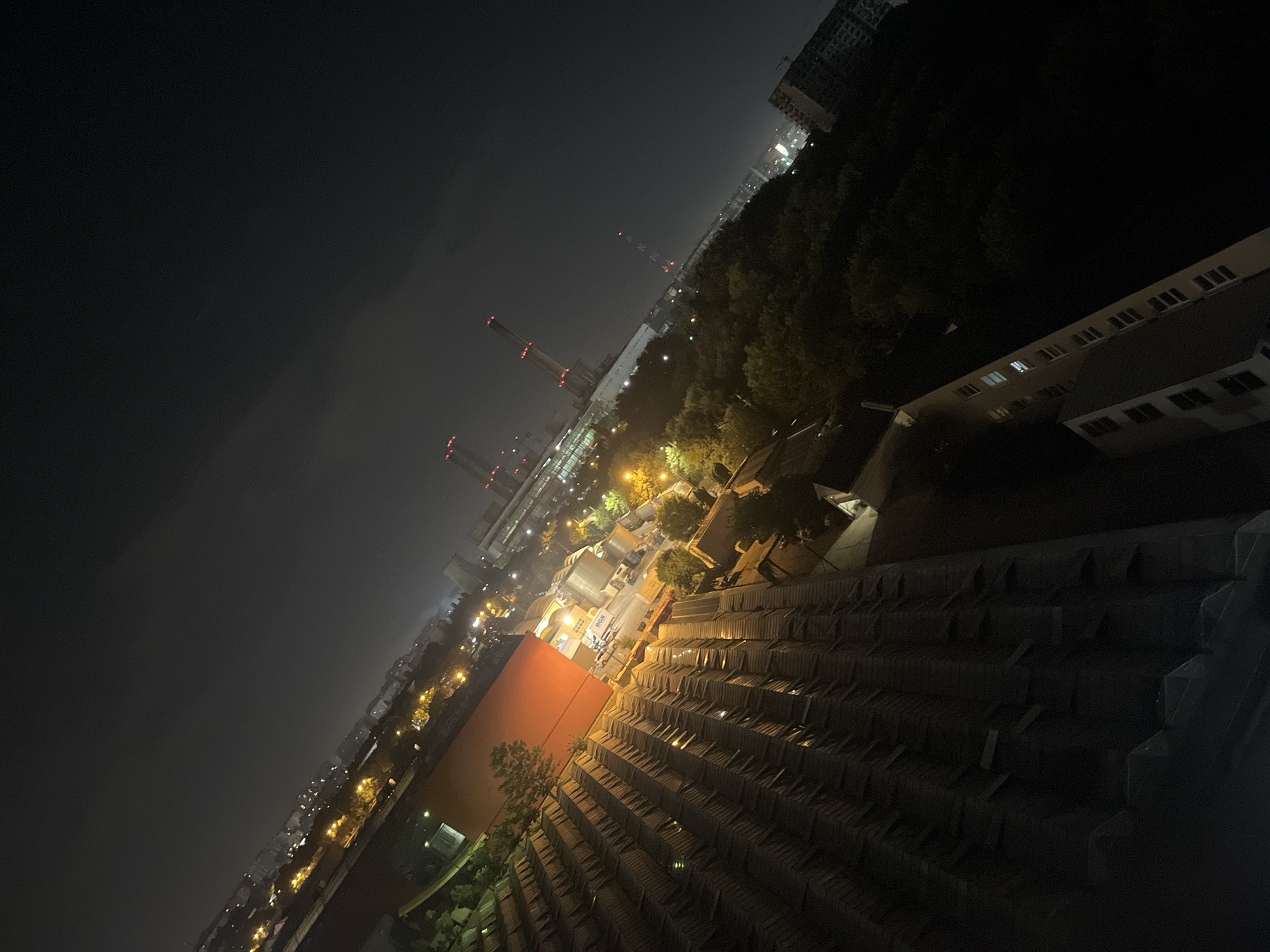 Nighttime aerial views over Bucharest's urban mix