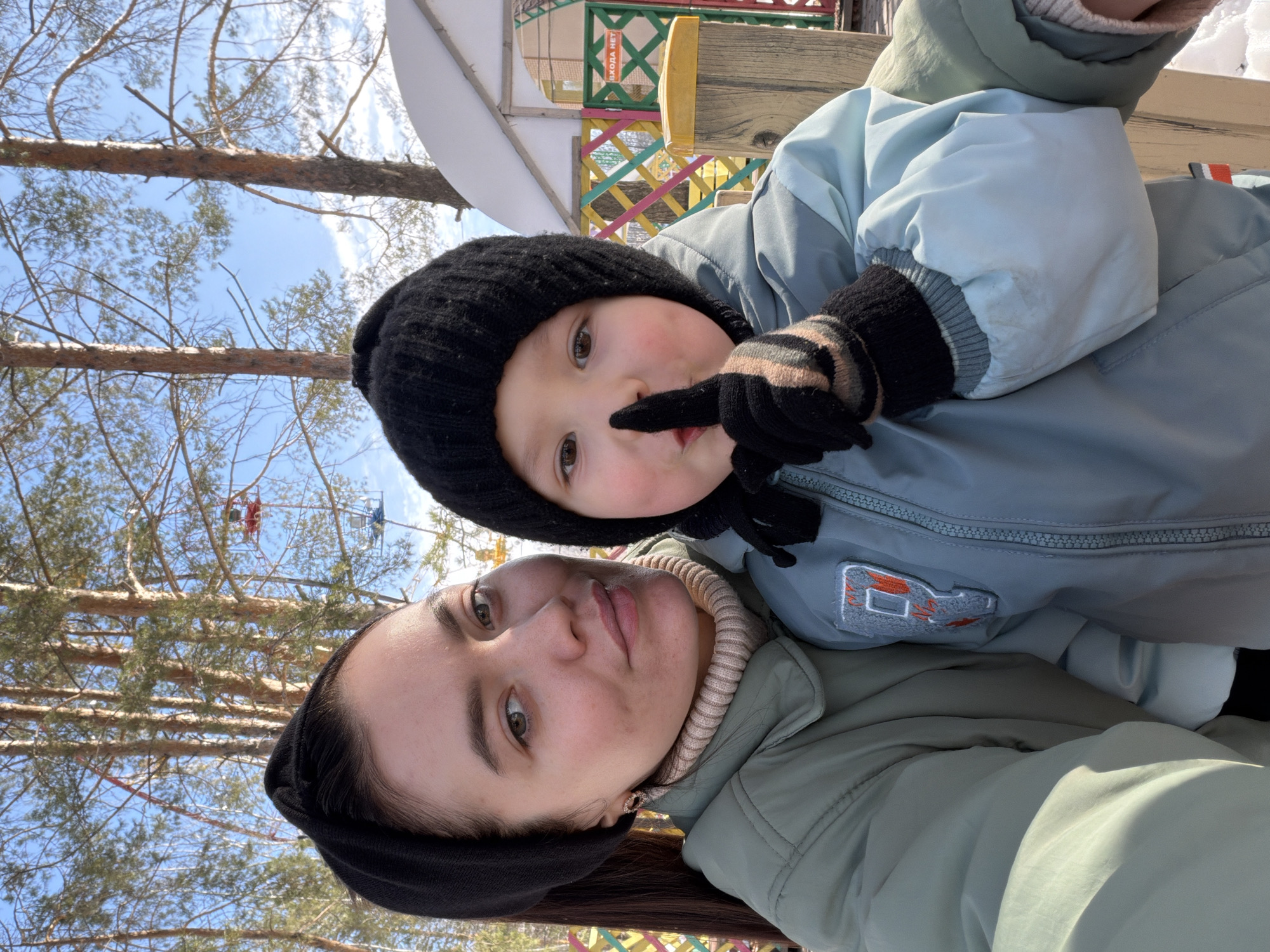 Mother and child enjoy sunny winter morning at Chaikovsky Park