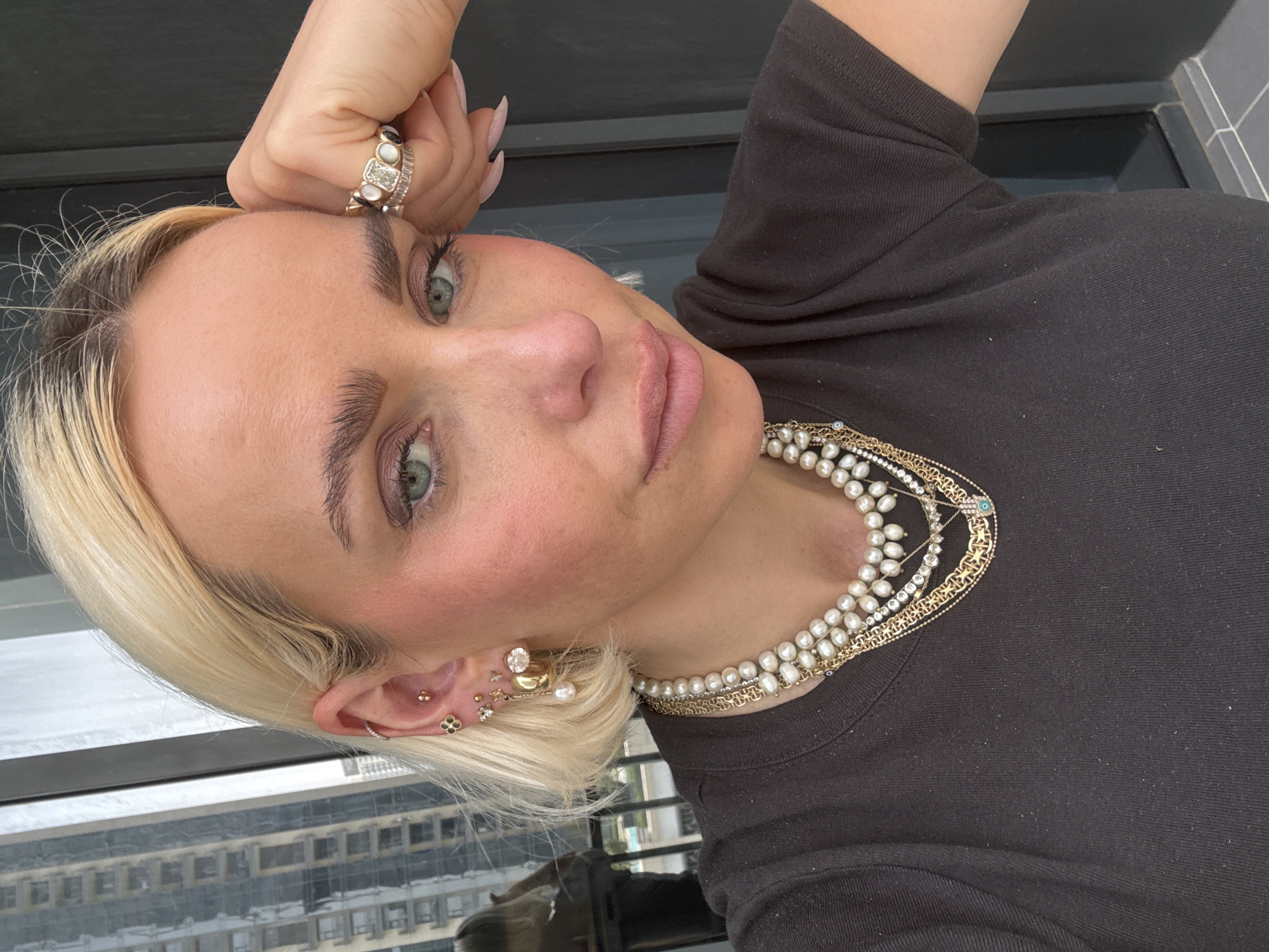 Woman displays elaborate jewelry collection during Dubai photo session