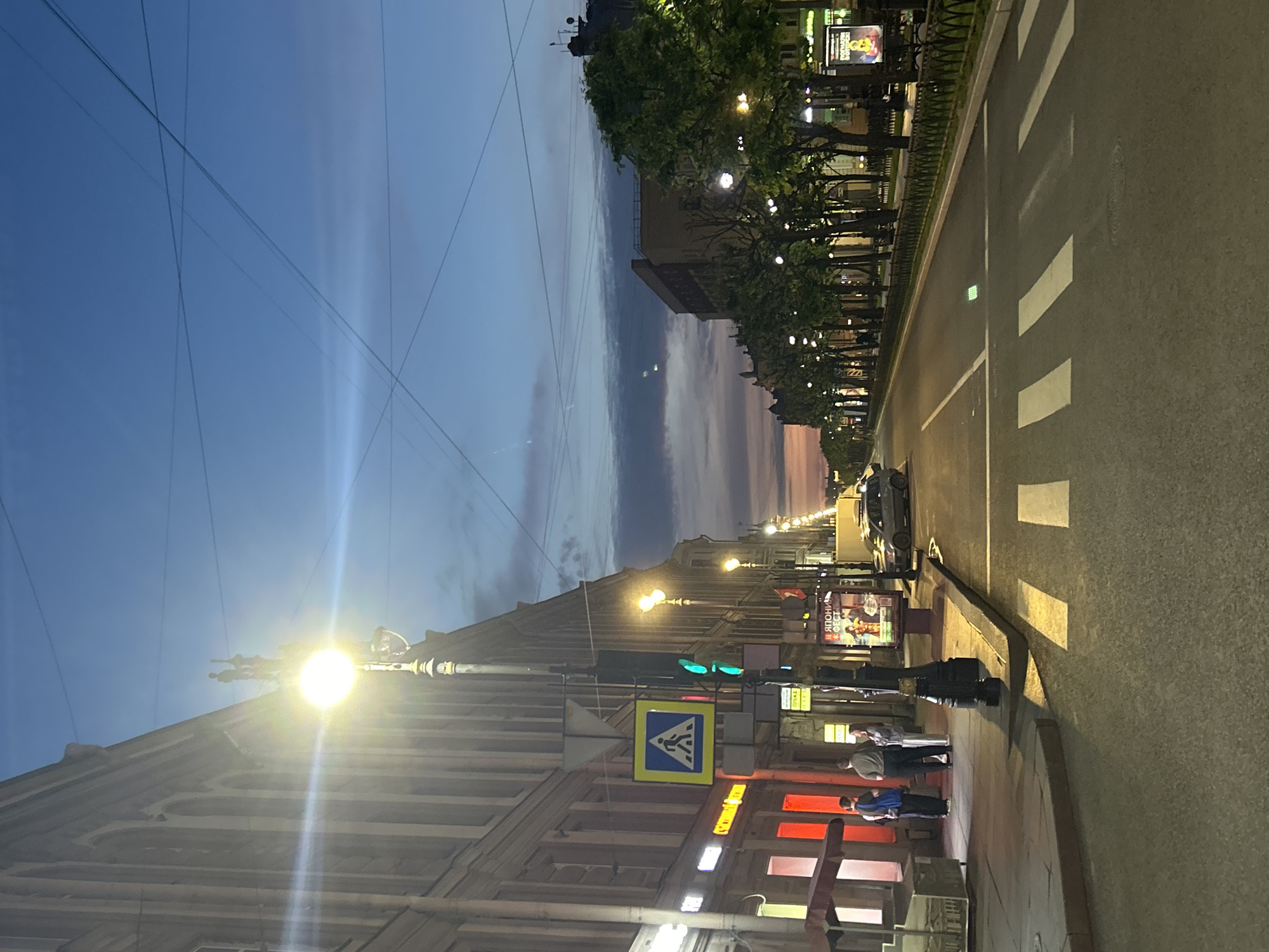 Twilight street scene with ornate architecture captured by witness