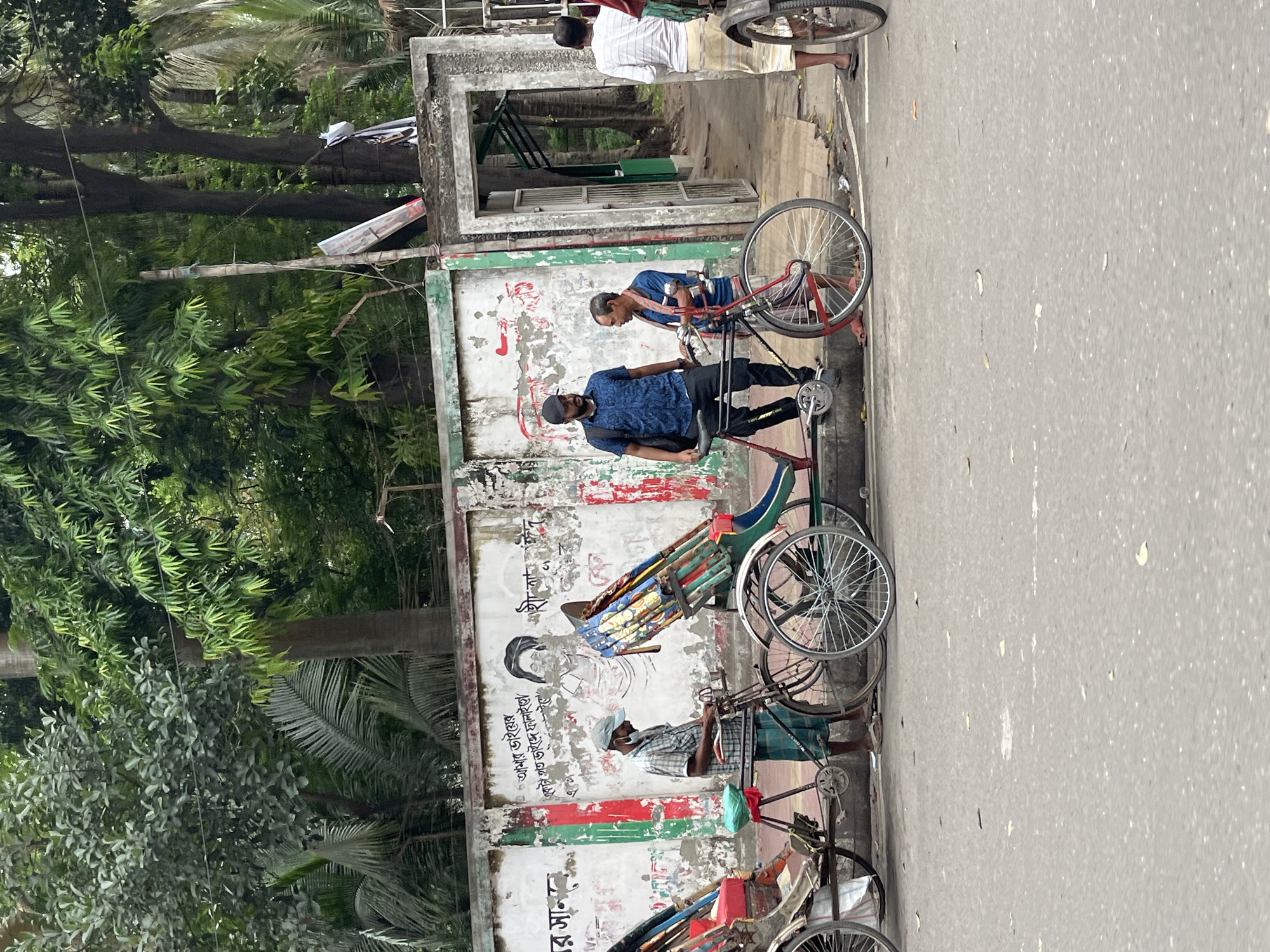 Daily life documented around Dhaka monuments and streets