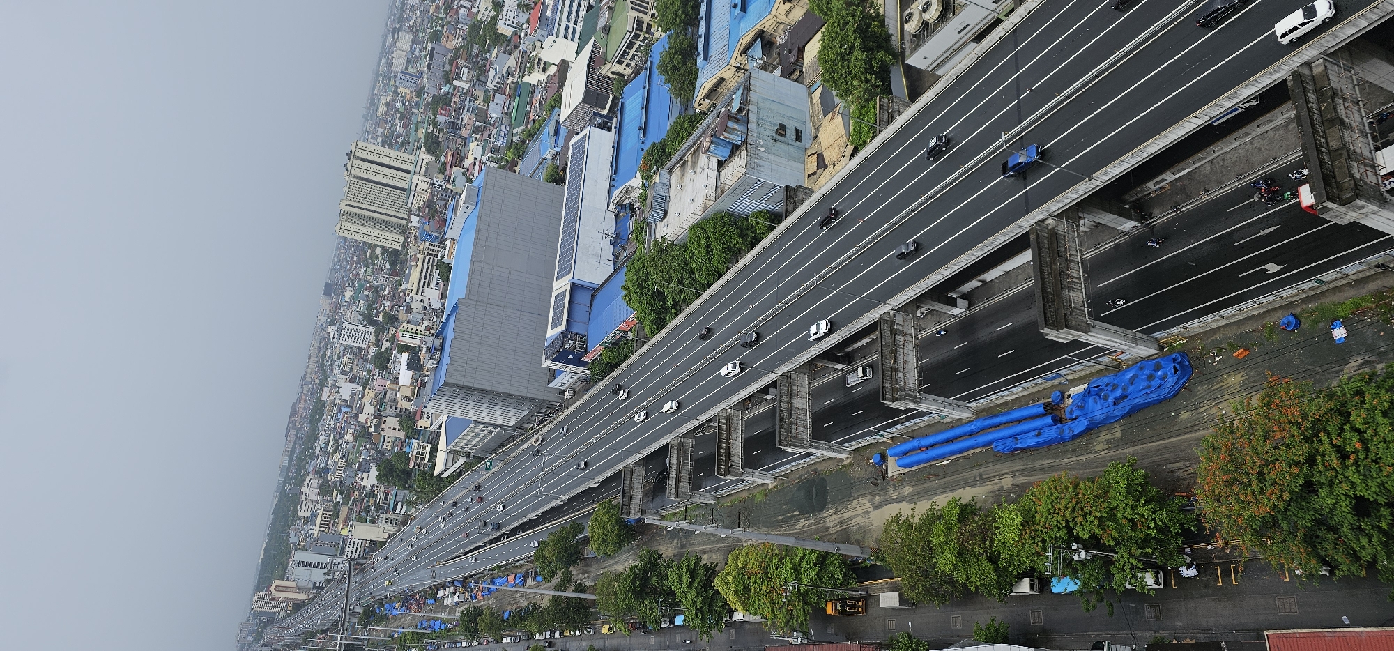 Makati from above: wet highways, busy streets, overcast skyline