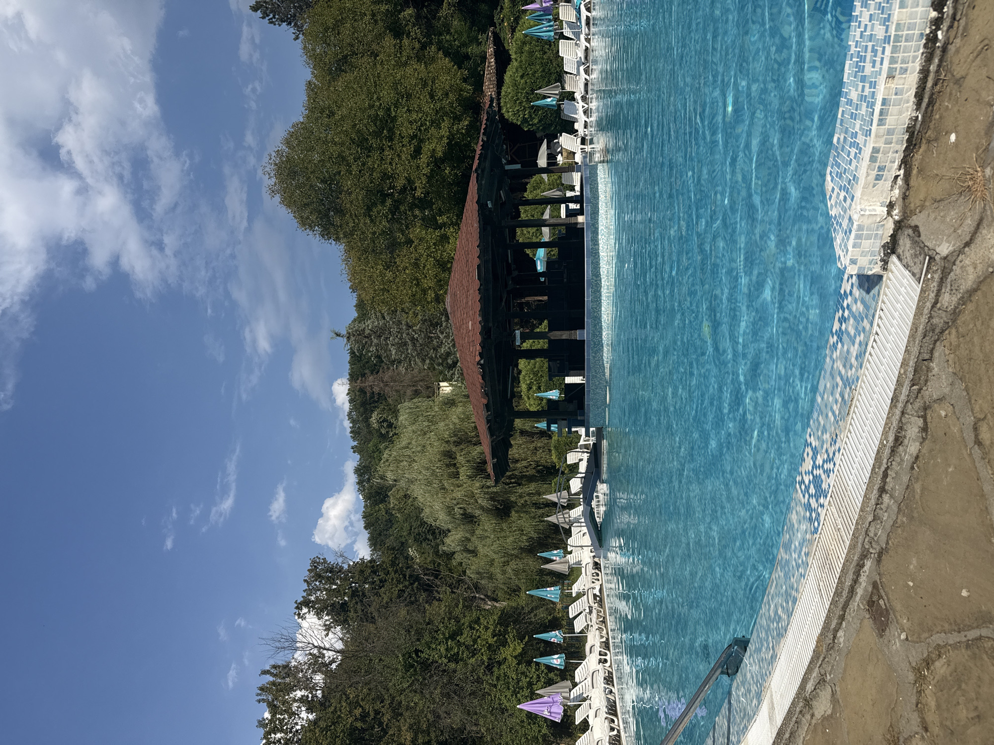 Lazy afternoon by a bright blue pool