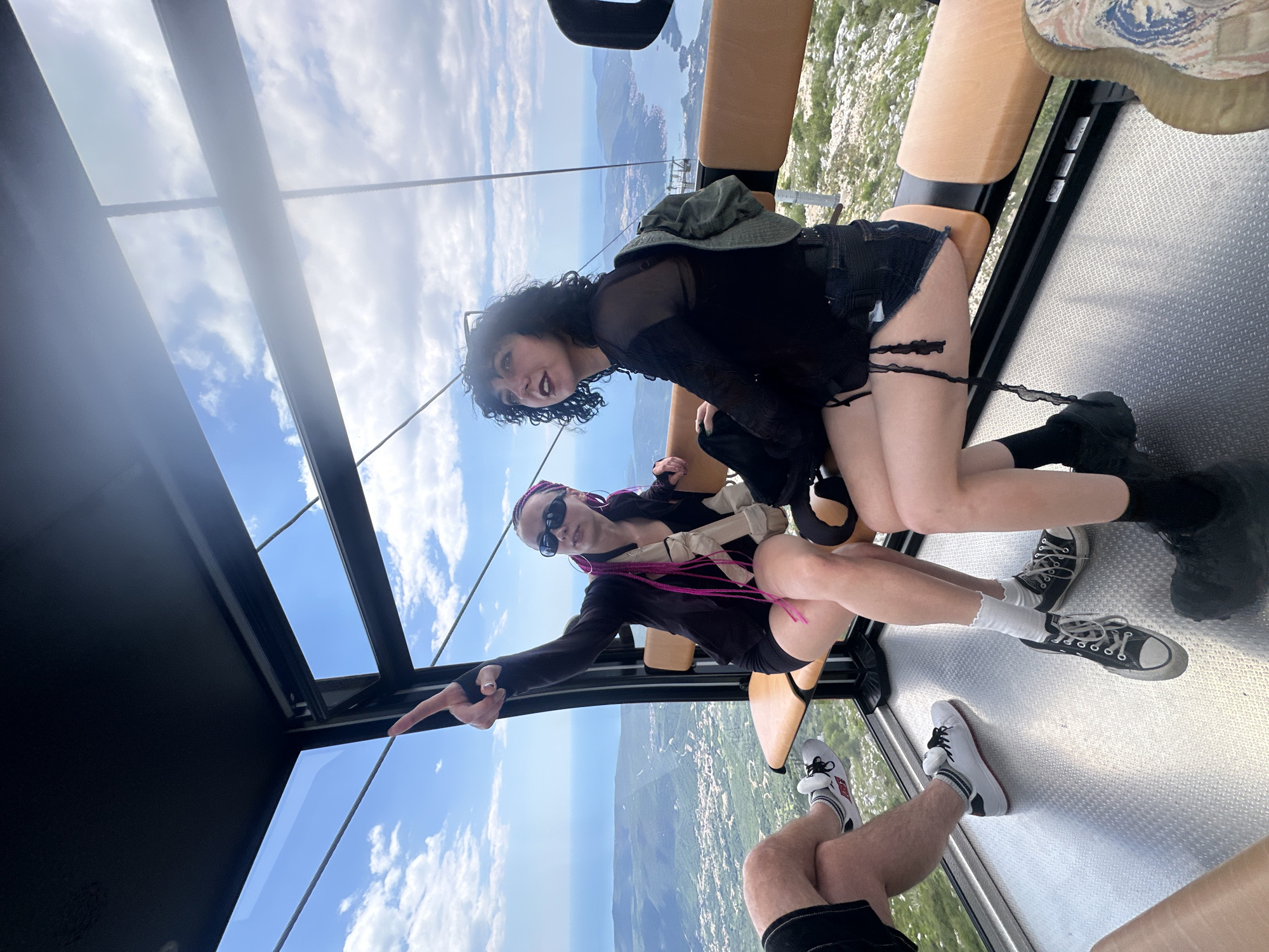 Cable car riders capture scenic Kotor Bay views in Montenegro