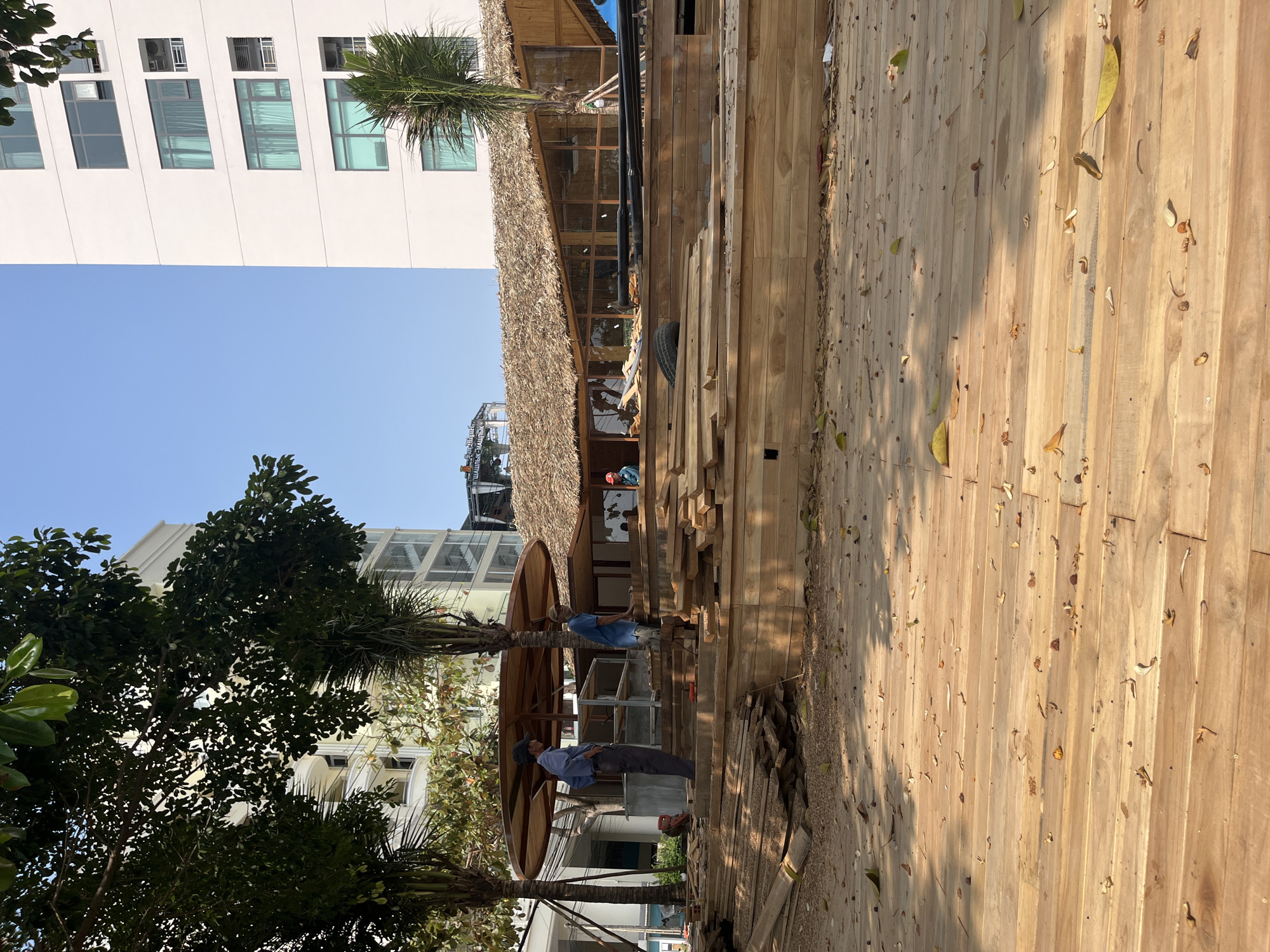Nighttime construction work continues on wooden structure in Vietnam