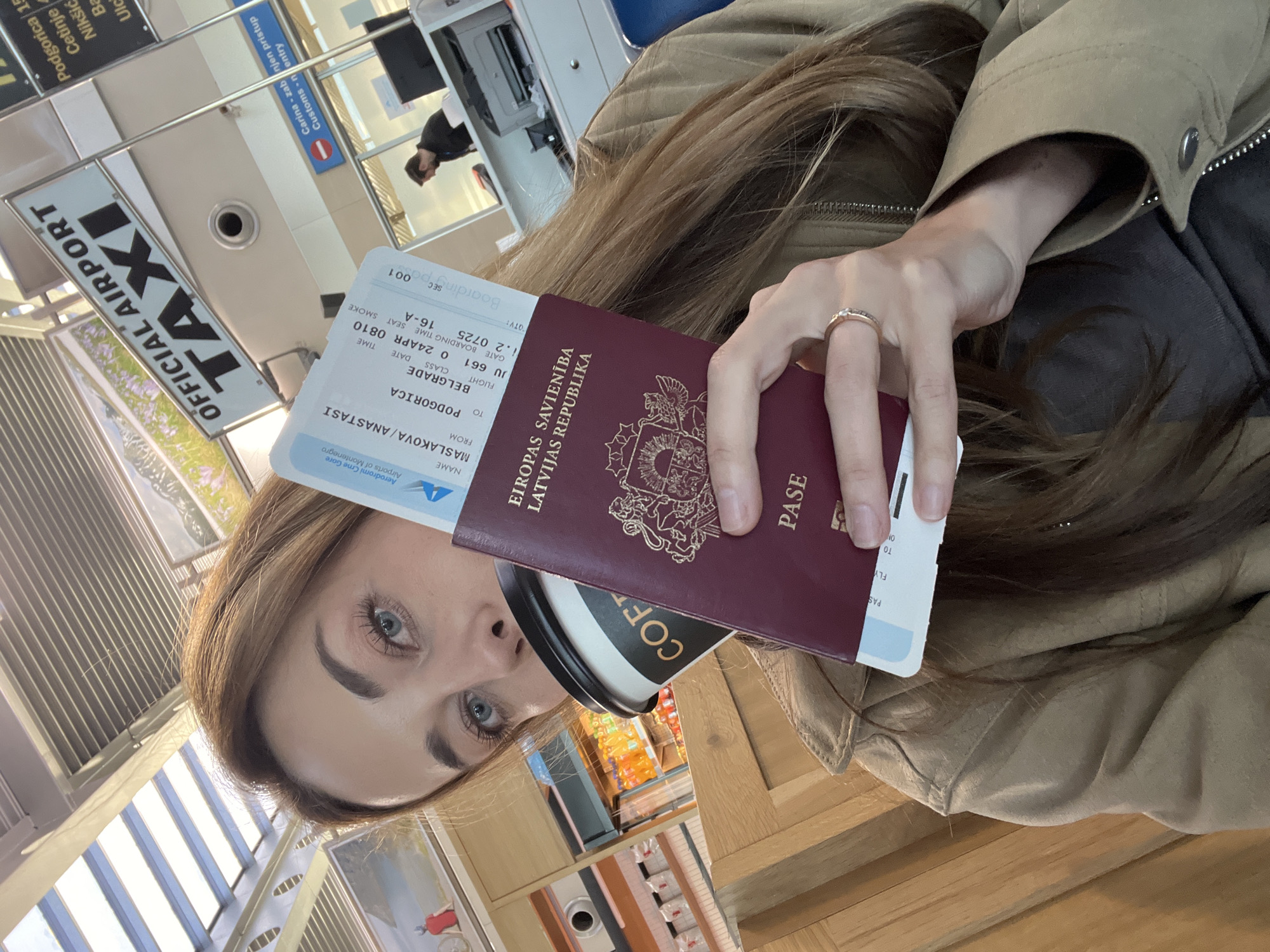 Latvian passenger prepares for Podgorica-Belgrade flight with coffee
