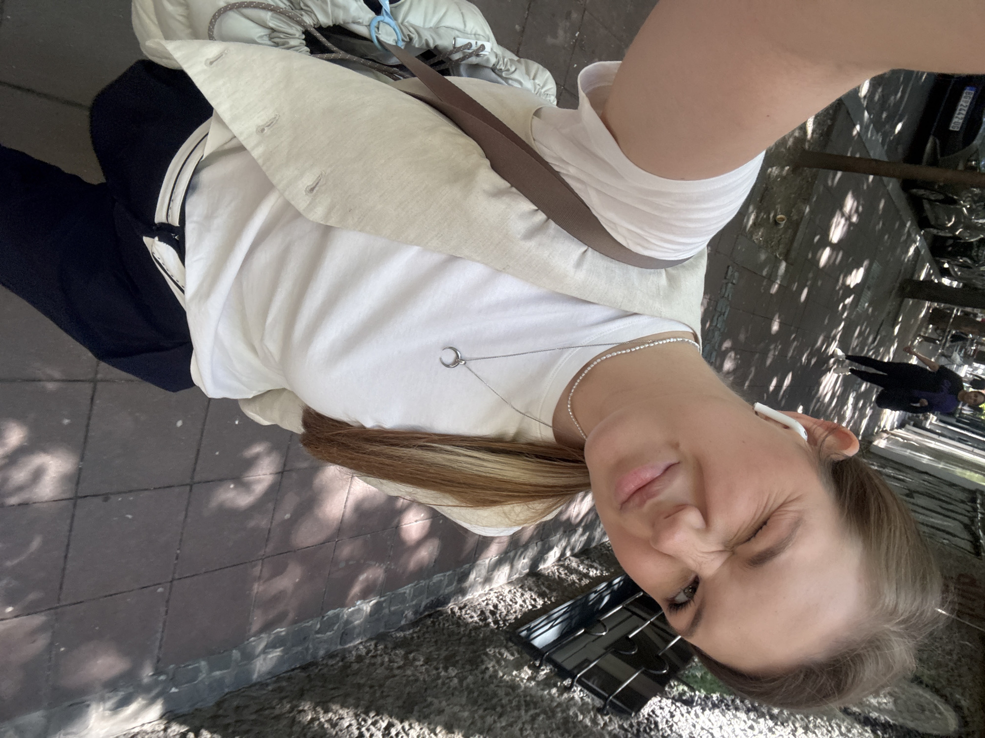 Woman enjoys morning coffee, takes selfies on Belgrade street
