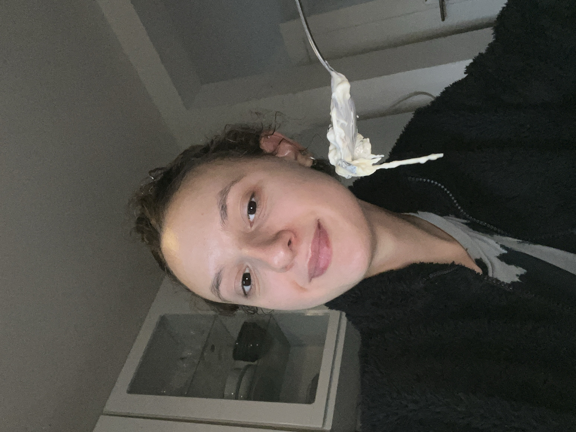 Woman enjoys evening meal with sparkling wine in Saarbrücken apartment