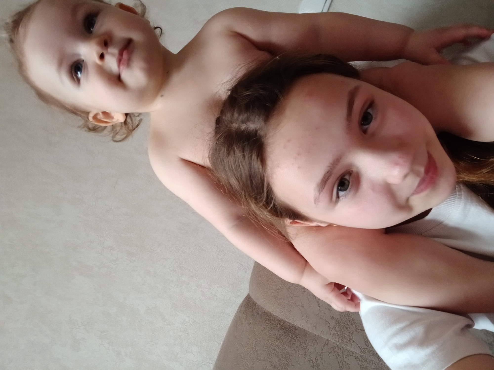 Children pose for casual family photos at home in Krasnodar