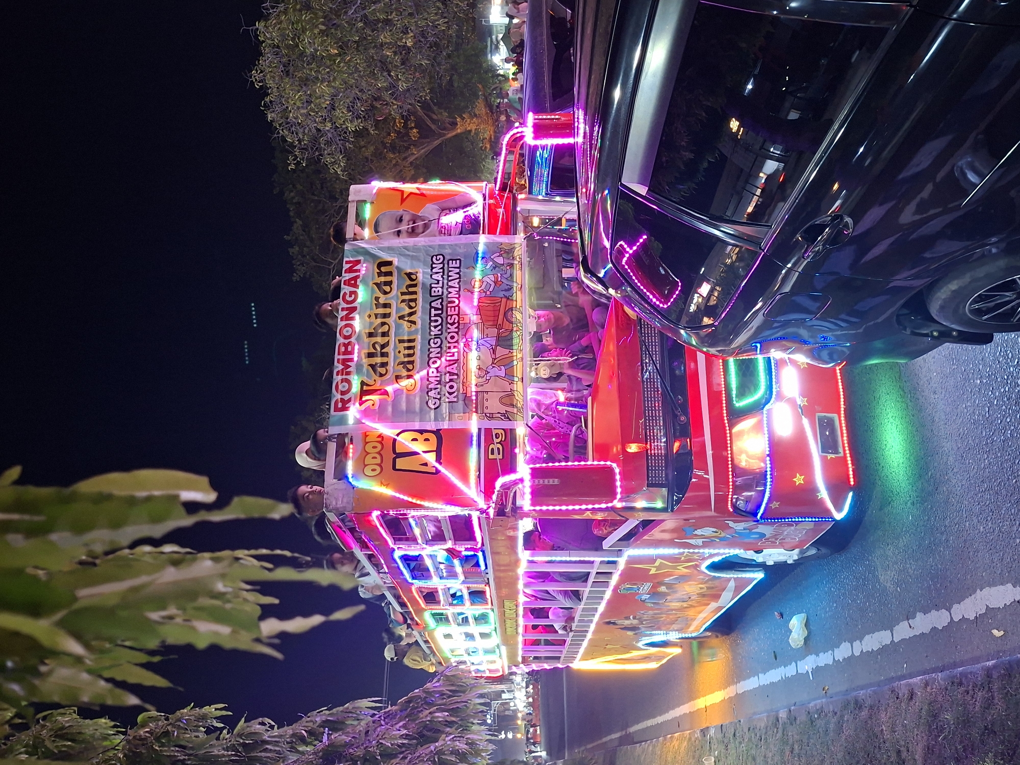 Nighttime parade with decorated vehicles draws crowds in Lhokseumawe