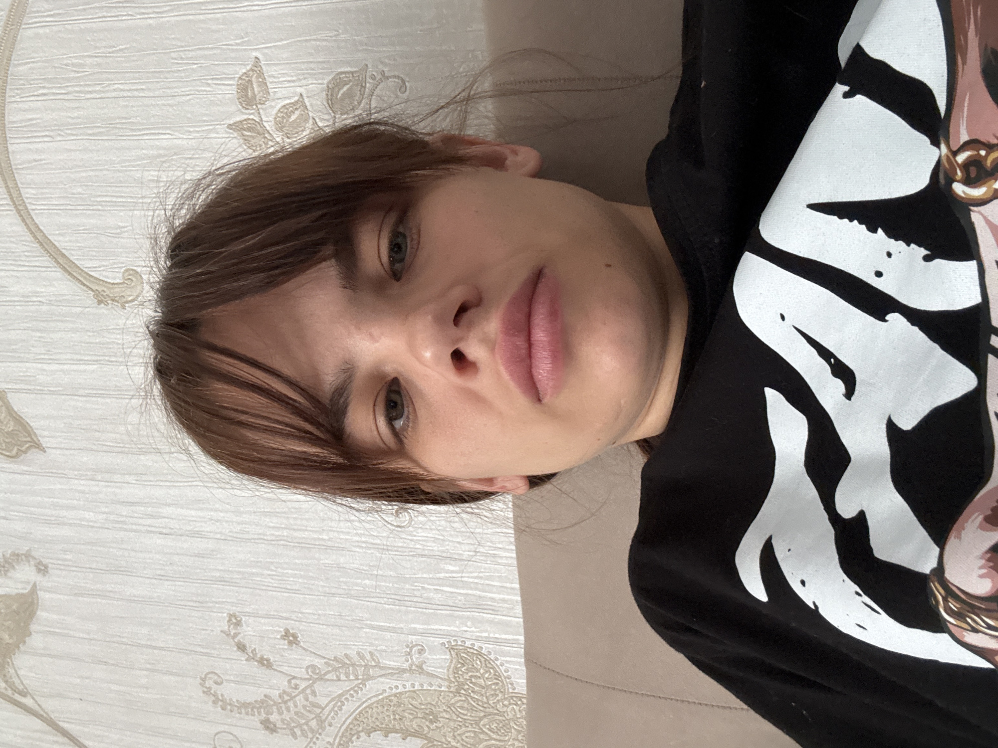 Woman takes multiple selfies on bed in Rostov-on-Don