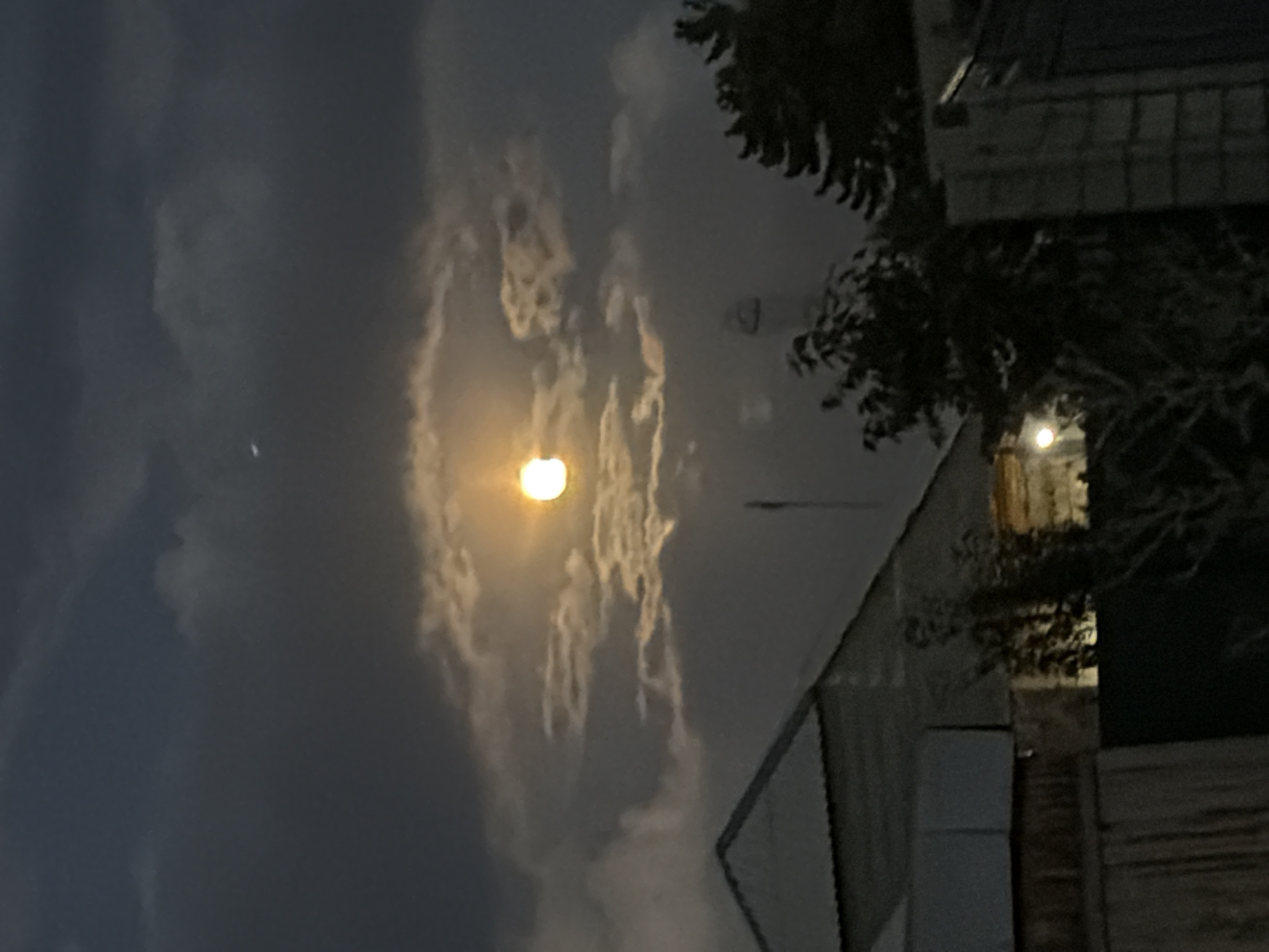 Full moon glows orange through clouds over Ak-Ordo 3