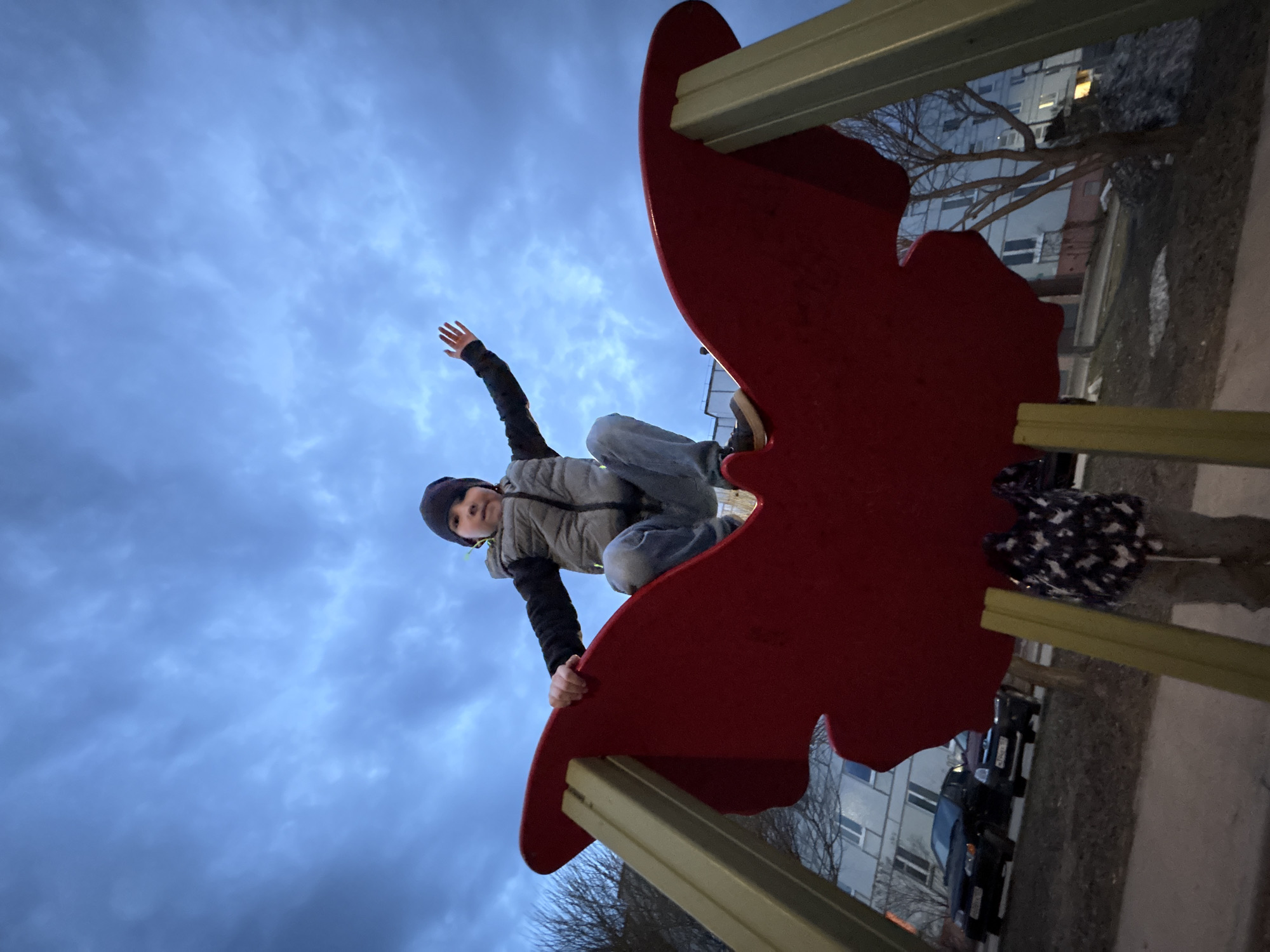 Family enjoys playground time in Chaikovsky during twilight hours