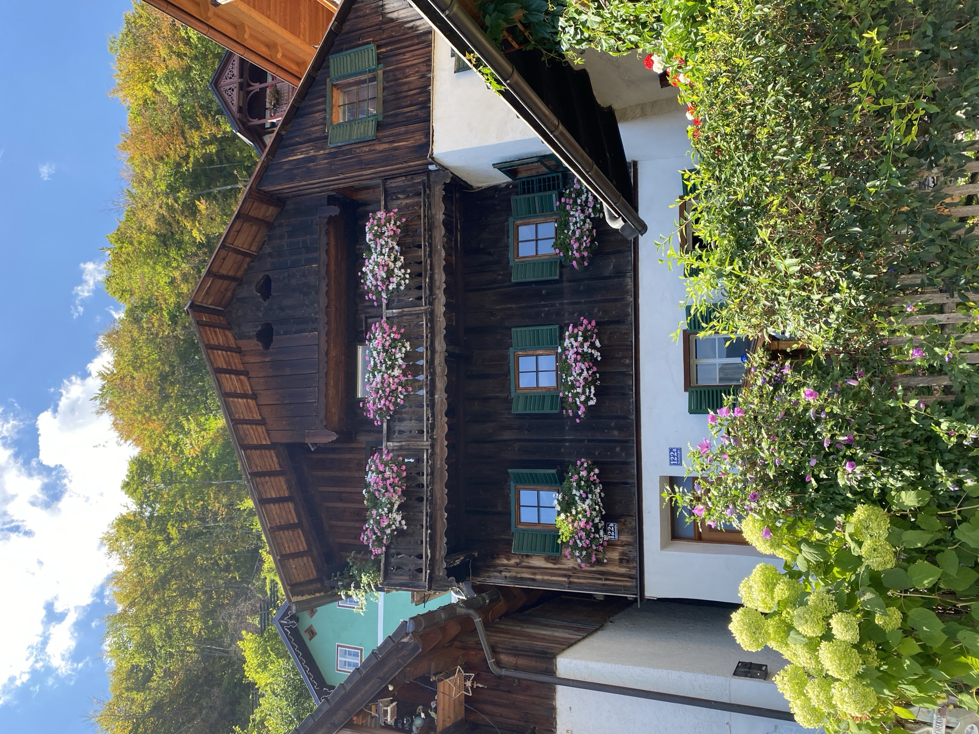 Weathered wooden building with window boxes in Hallstatt, Austria