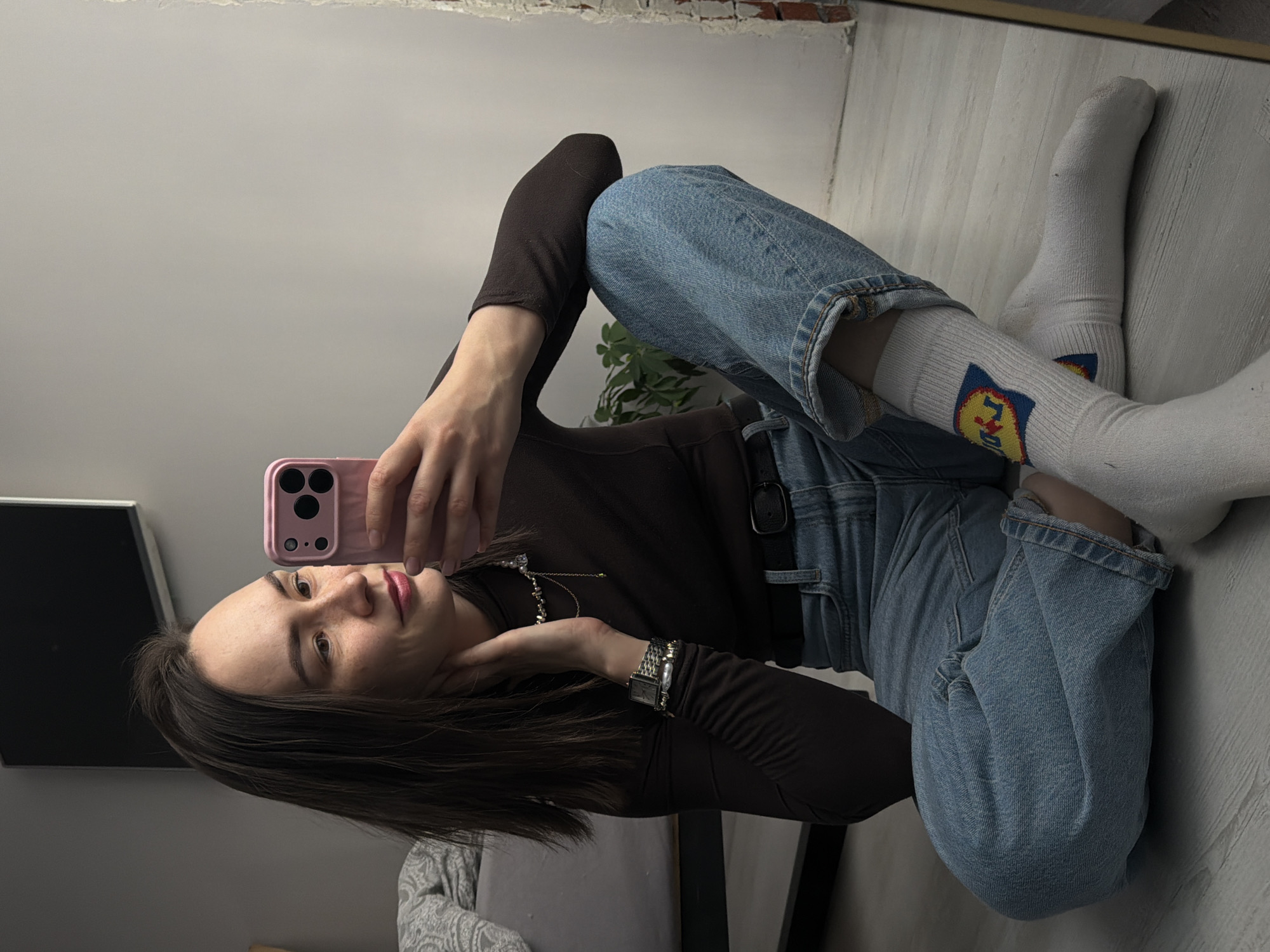 Woman takes mirror selfies indoors in Chaikovsky, Russia