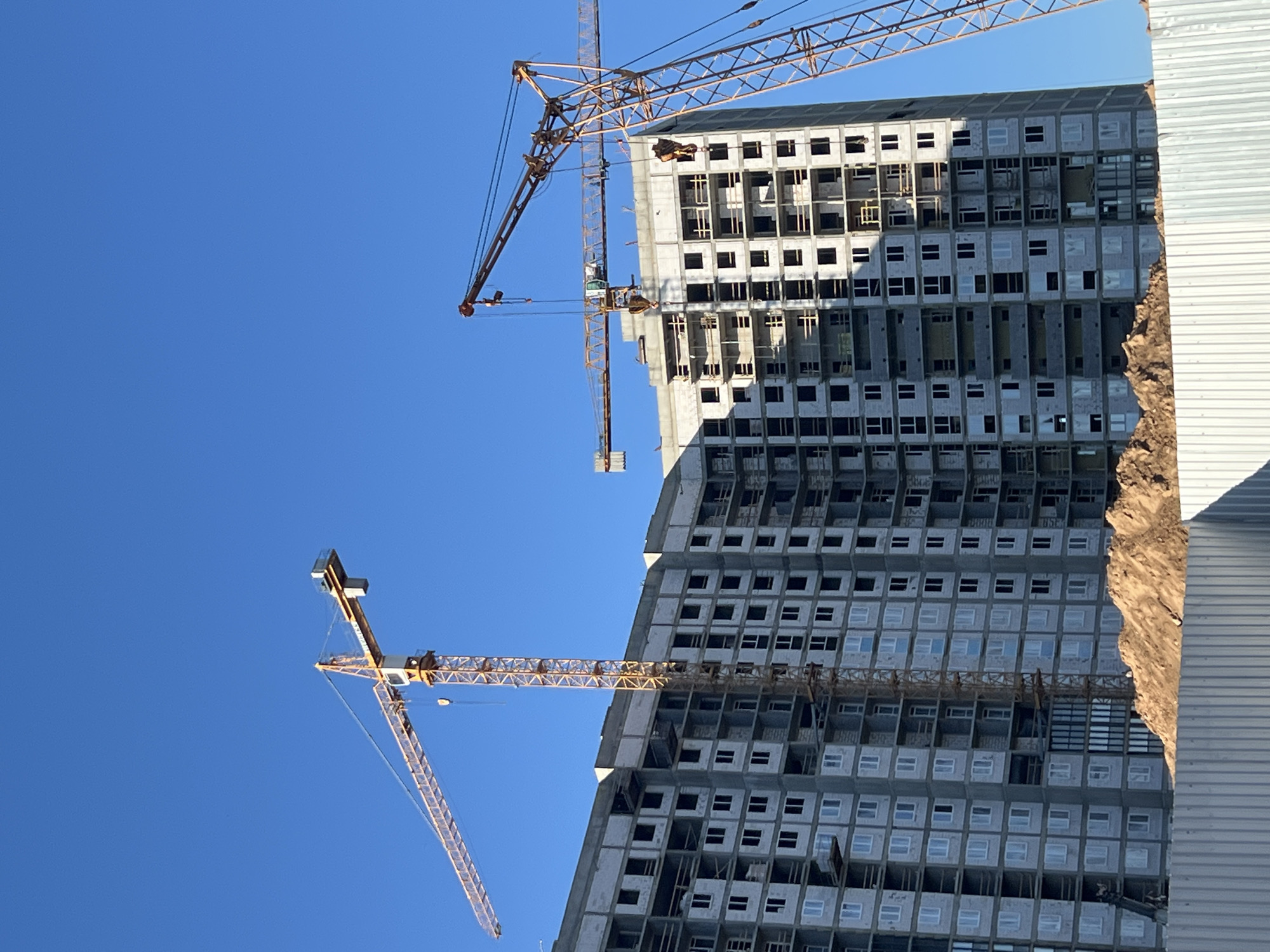Active construction zone and street-level commercial scene in Minsk