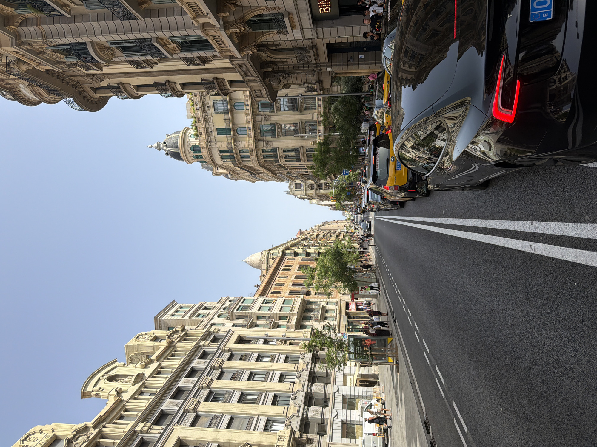 Sunny afternoon on Barcelona's ornate, bustling streets