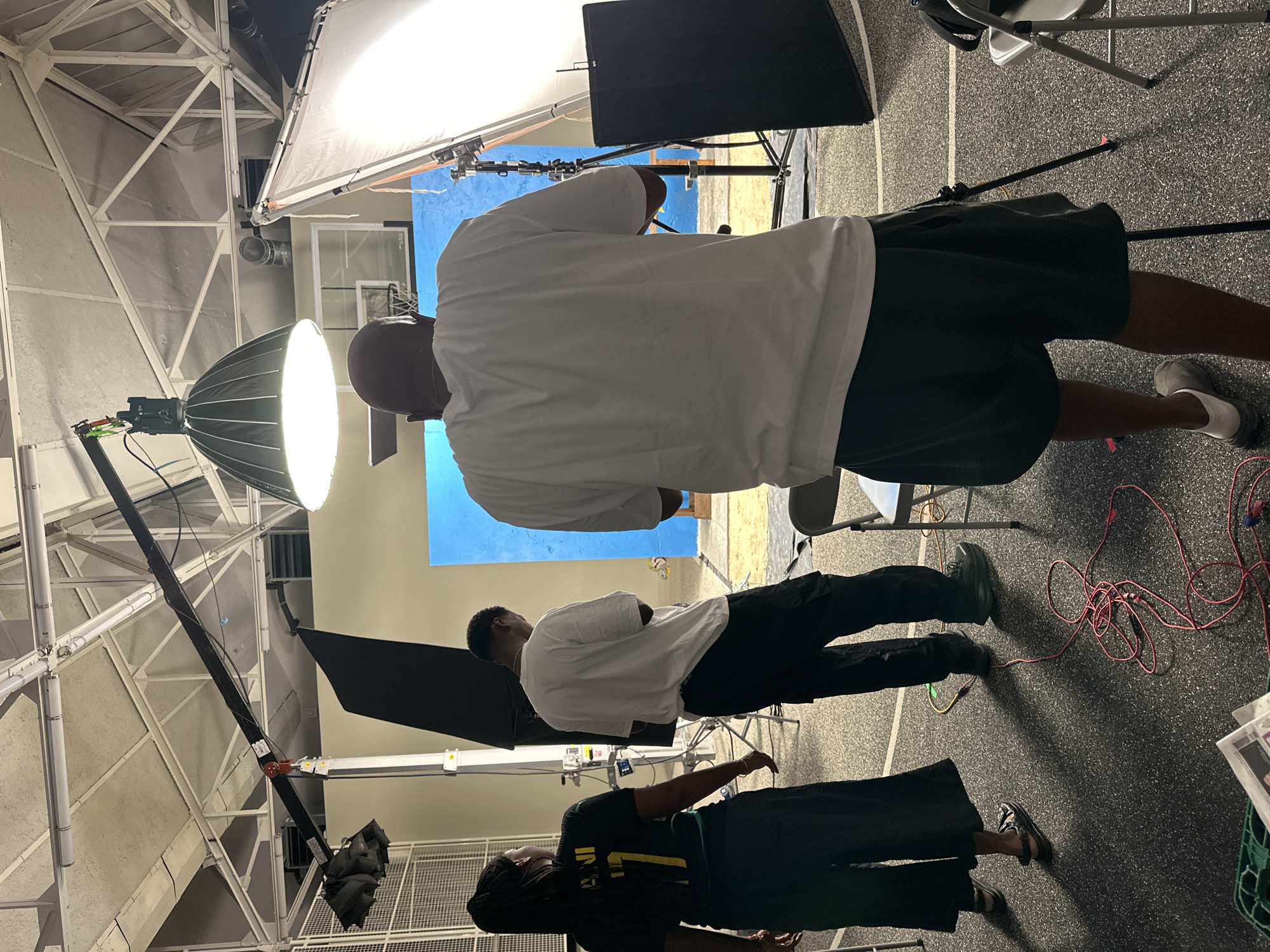 Three people gather in Montreuil studio space