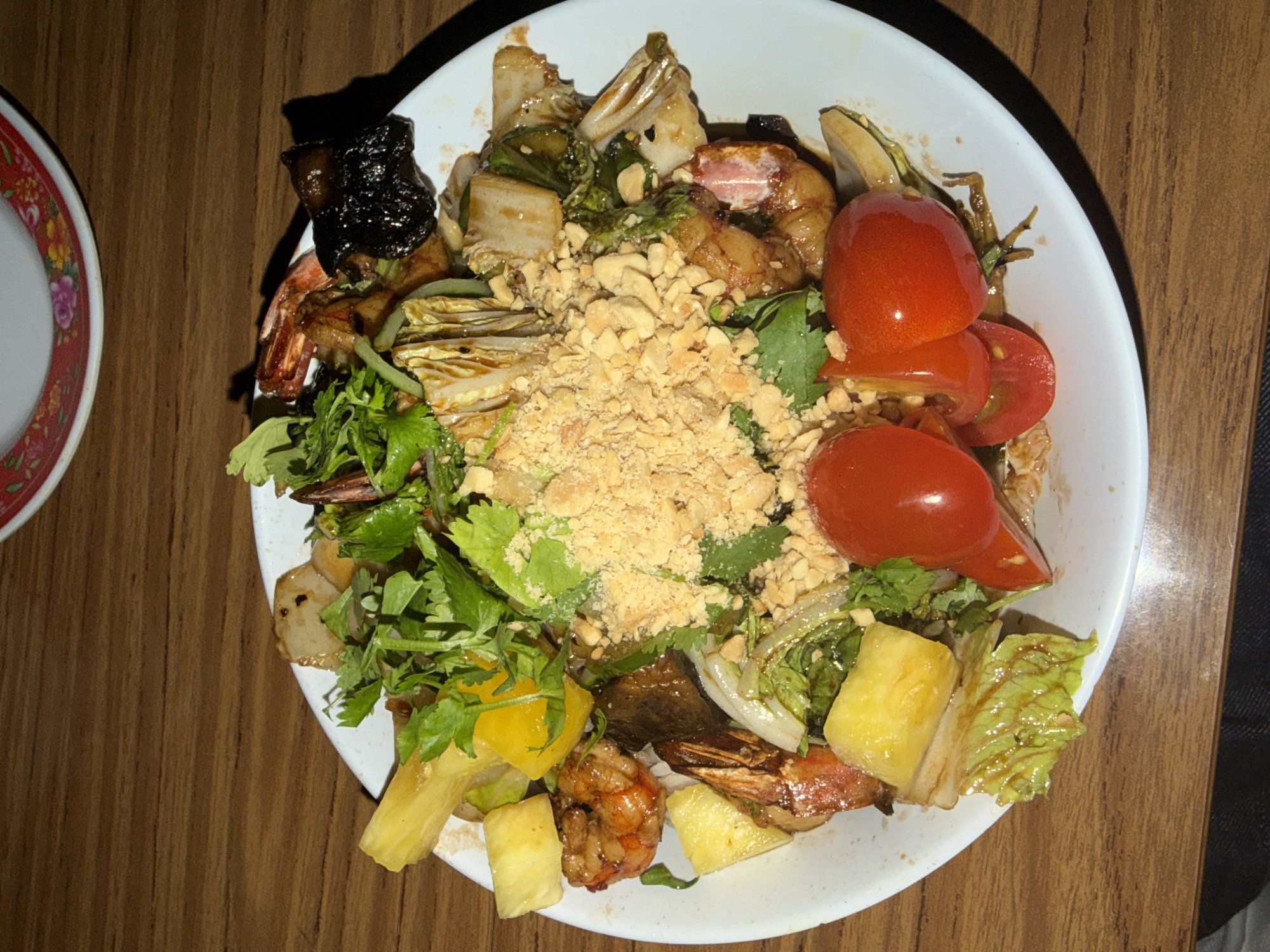 Shrimp salad meal documented on wooden table in Buenos Aires