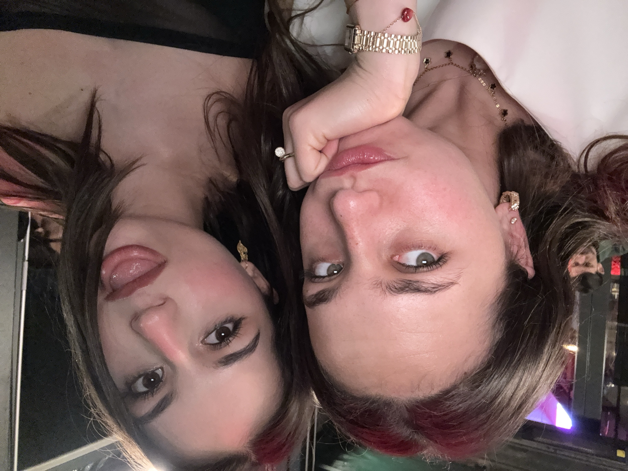 Two women take selfie at Milan bar table